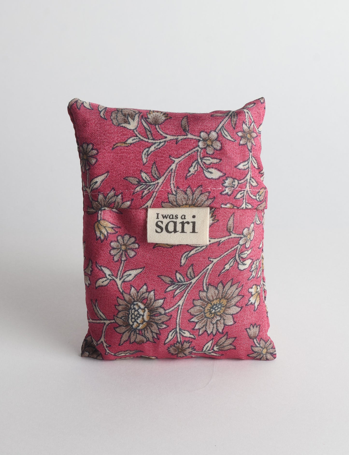 Stay eco-conscious with our Reusable Bag, handmade by Indian artisans from pre-loved saris. Silky and lightweight, this foldaway bag is perfect for your on-the-go lifestyle. Each piece is a unique statement of ethical fashion, embracing sustainability and style.