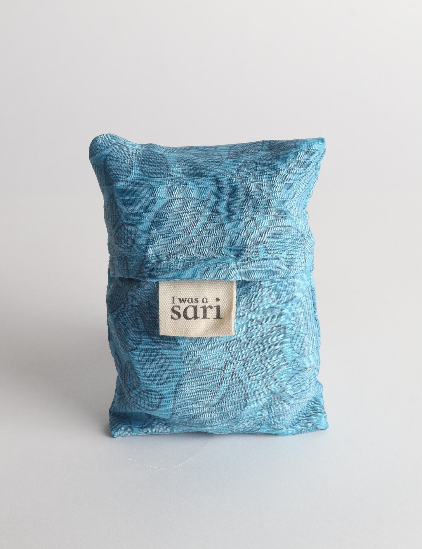 Stay eco-conscious with our Reusable Bag, handmade by Indian artisans from pre-loved saris. Silky and lightweight, this foldaway bag is perfect for your on-the-go lifestyle. Each piece is a unique statement of ethical fashion, embracing sustainability and style.