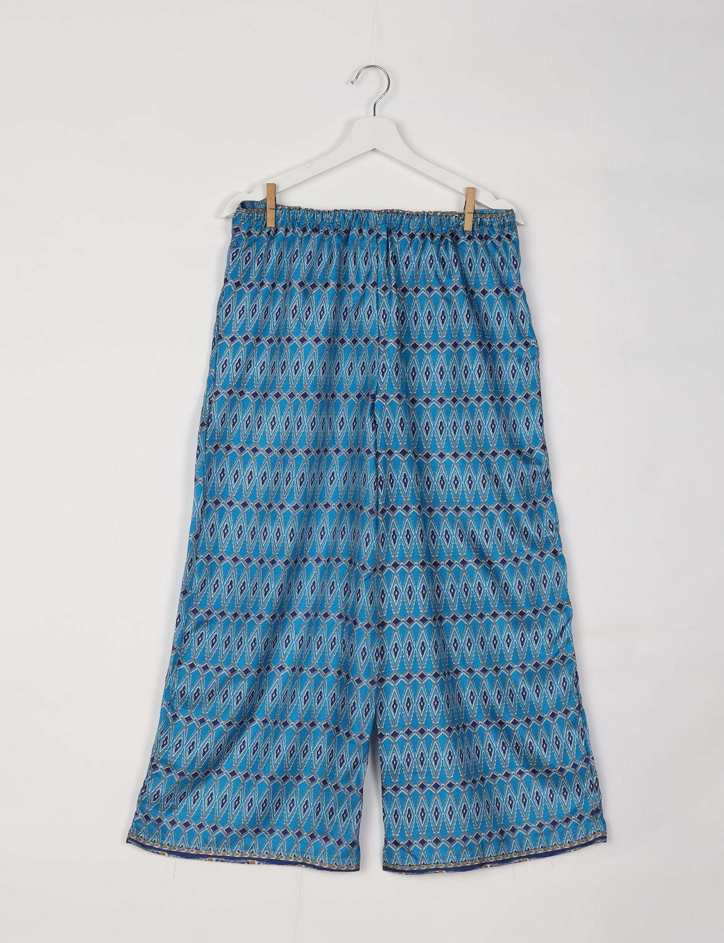 Step into sustainable fashion with our Palazzo Pants – a harmonious blend of Indian and Italian influences. These wide-legged pants, made from upcycled saris, offer comfort with an all-around elastic waist and a stylish flared leg. Make a statement with eco-friendly, chic palazzo pants that redefine ethical clothing.