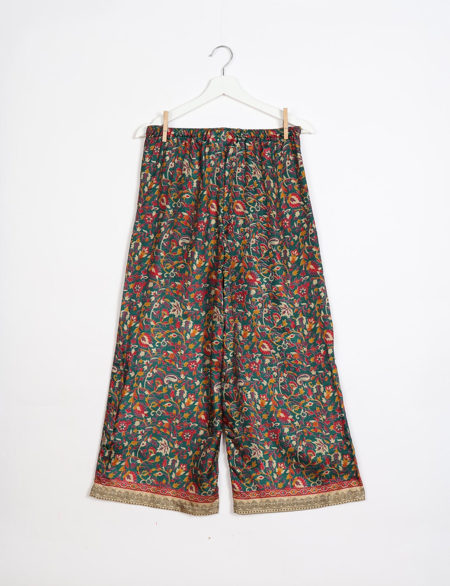 Step into sustainable fashion with our Palazzo Pants – a harmonious blend of Indian and Italian influences. These wide-legged pants, made from upcycled saris, offer comfort with an all-around elastic waist and a stylish flared leg. Make a statement with eco-friendly, chic palazzo pants that redefine ethical clothing.