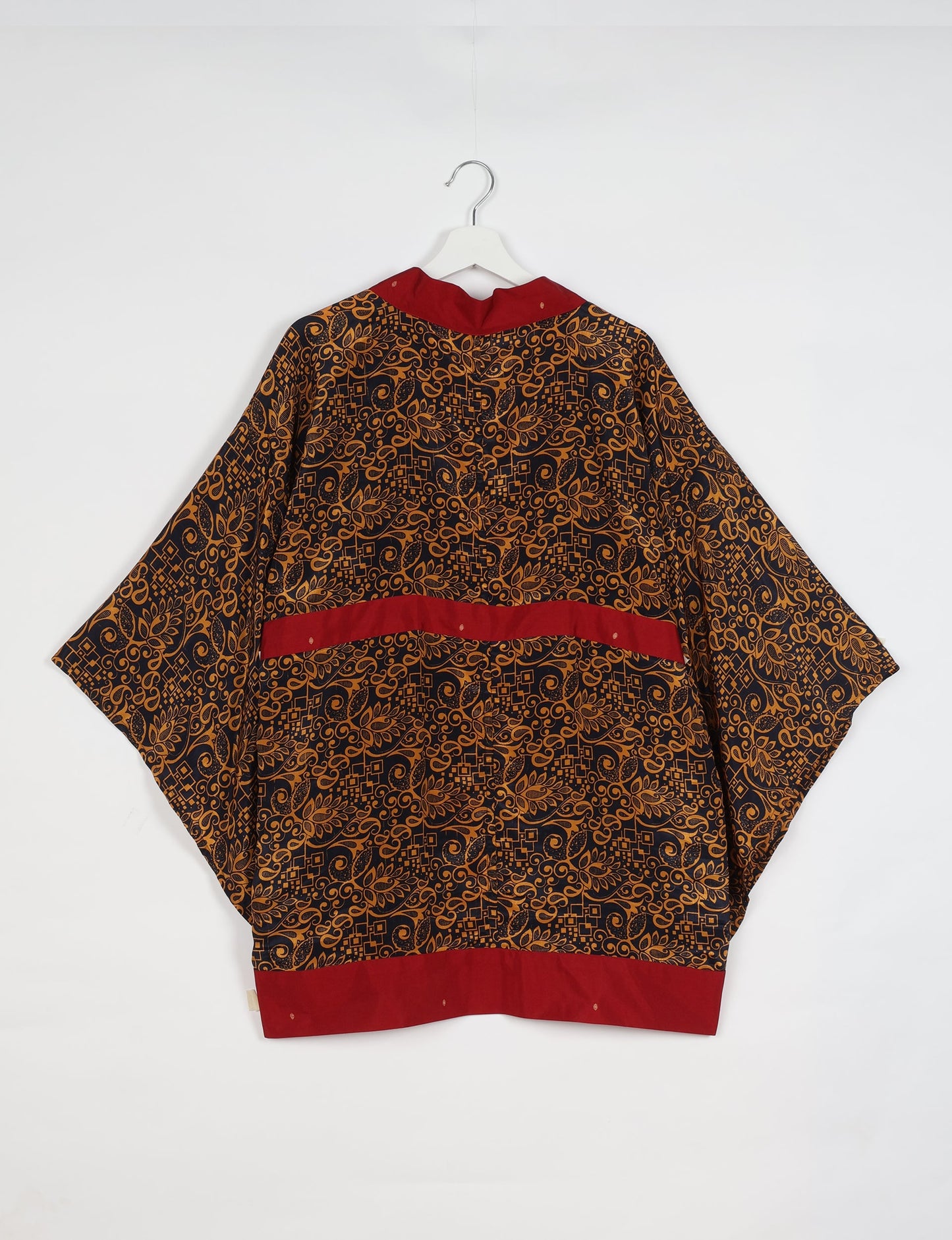 Radiant and sustainably crafted KIMONO with humble beginnings from the streets of India. Versatile and eco-friendly layering piece for casual trousers, swimwear, or our spaghetti strap dress. Embrace conscious fashion and sustainable style with this unique and culturally inspired kimono, sure to invite compliments.