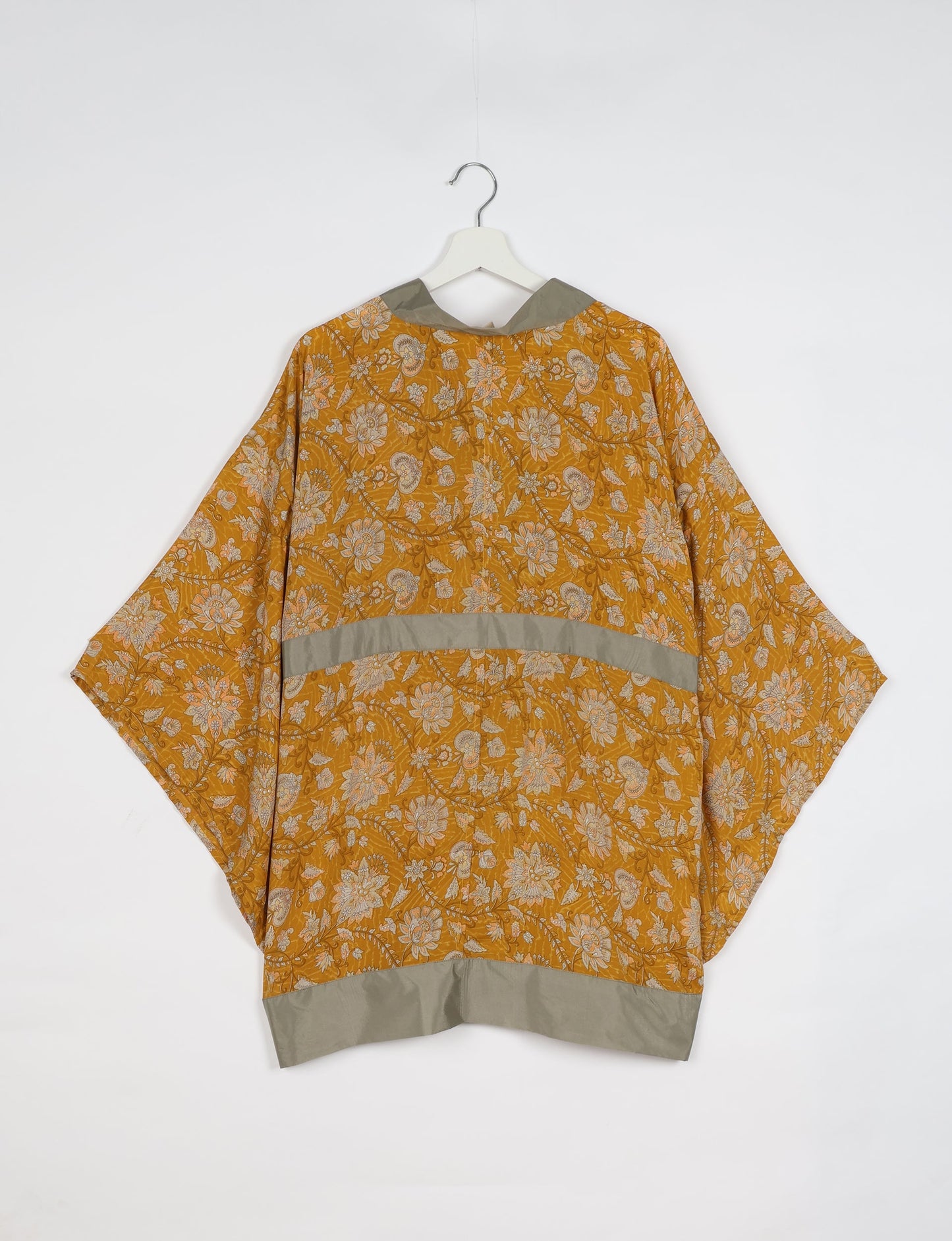 Radiant and sustainably crafted KIMONO with humble beginnings from the streets of India. Versatile and eco-friendly layering piece for casual trousers, swimwear, or our spaghetti strap dress. Embrace conscious fashion and sustainable style with this unique and culturally inspired kimono, sure to invite compliments.