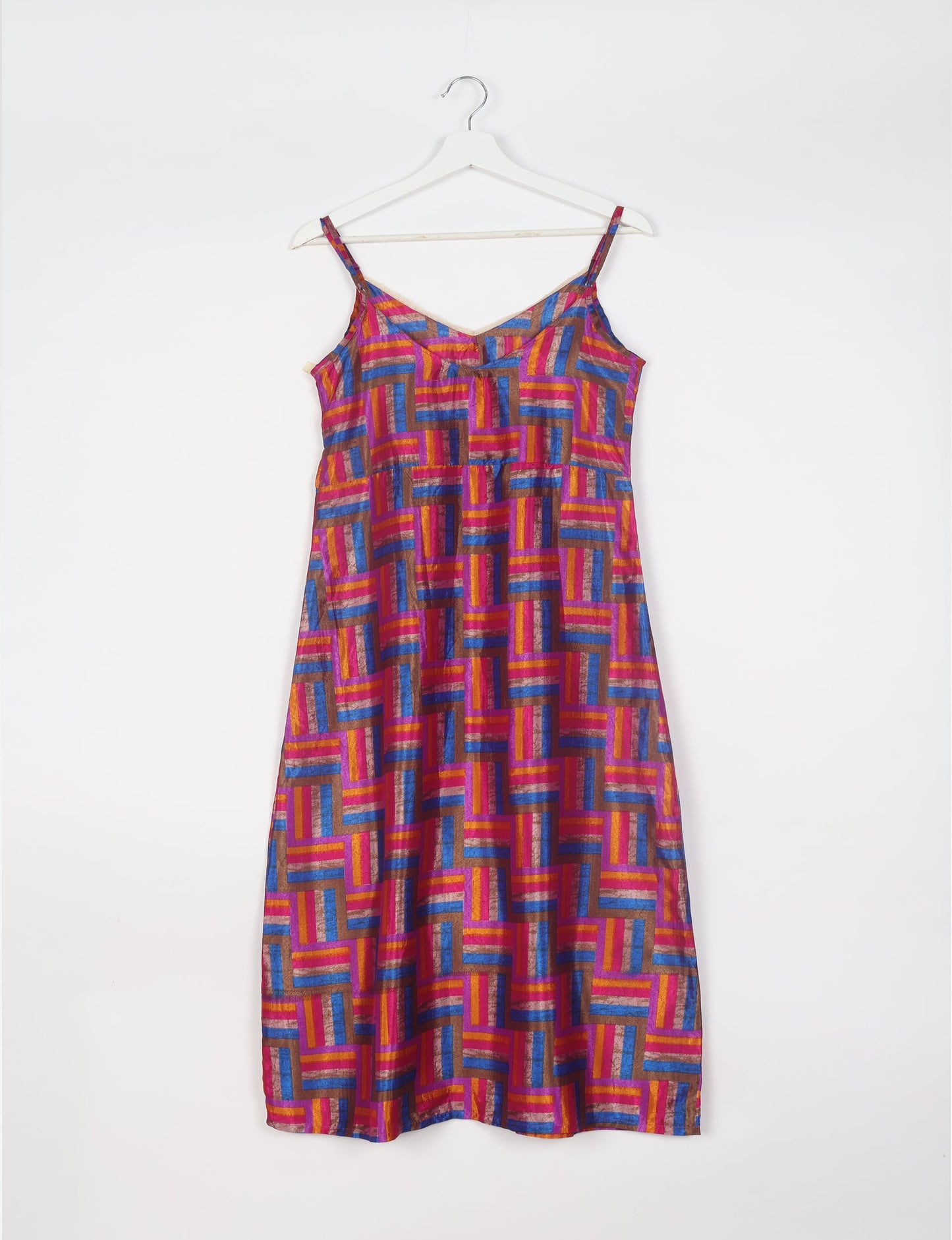 Spaghetti strap dress made from sustainable materials, embodying ethical fashion principles. Ideal for eco-friendly travelers seeking laid-back style.