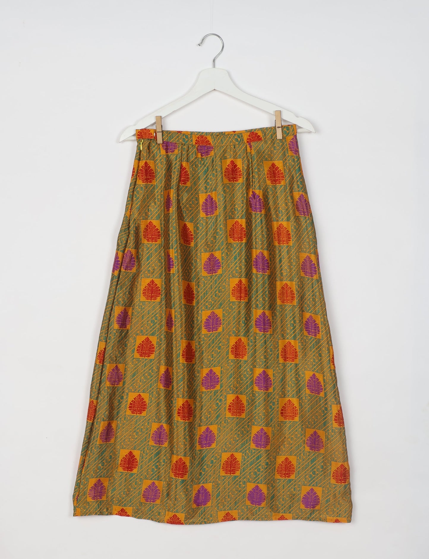 Sustainable A LINE SKIRT, a high-fashion choice for conscious individuals. Fitted at the waist, ankle-length, and ethically crafted for eco-friendly style.