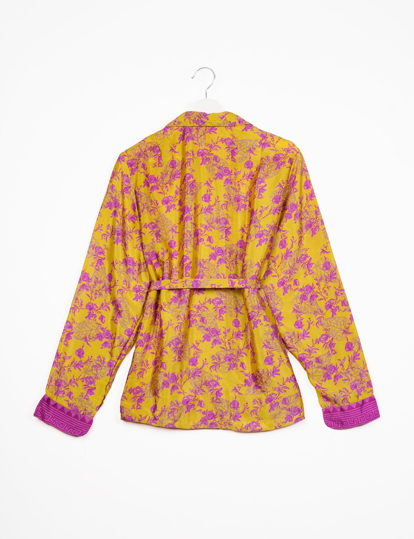 Experience sustainable fashion with our classic slim-fit shirt, crafted with ethical and green values. The shirt, designed for minimal waste, features a tie-up waist belt or neck tie, semi-spread collar, and regular shirt cuffs. Versatile and eco-friendly, wear it tucked in, unbuttoned over a tank top, or knotted at the waist for a unique style.