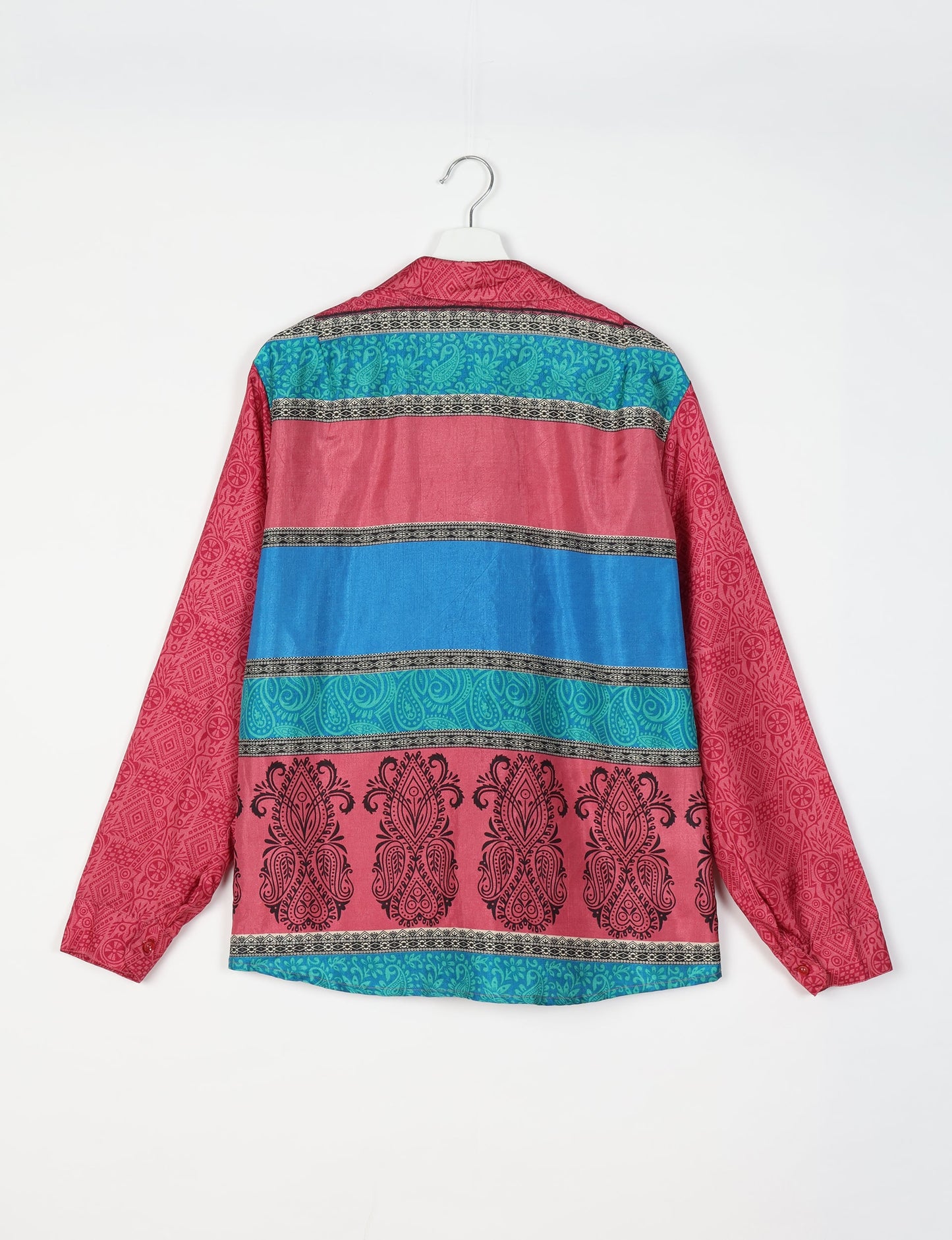 Experience sustainable fashion with our classic slim-fit shirt, crafted with ethical and green values. The shirt, designed for minimal waste, features a tie-up waist belt or neck tie, semi-spread collar, and regular shirt cuffs. Versatile and eco-friendly, wear it tucked in, unbuttoned over a tank top, or knotted at the waist for a unique style.