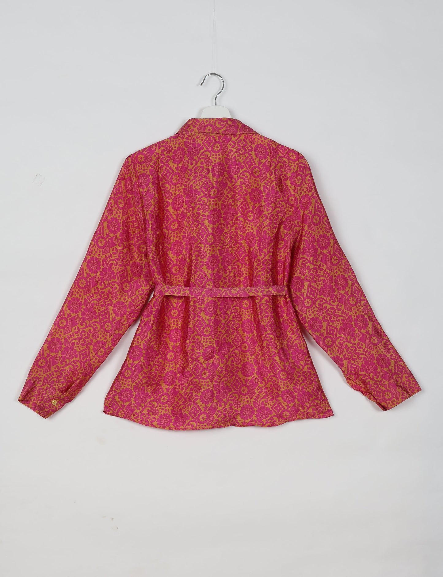 Experience sustainable fashion with our classic slim-fit shirt, crafted with ethical and green values. The shirt, designed for minimal waste, features a tie-up waist belt or neck tie, semi-spread collar, and regular shirt cuffs. Versatile and eco-friendly, wear it tucked in, unbuttoned over a tank top, or knotted at the waist for a unique style.