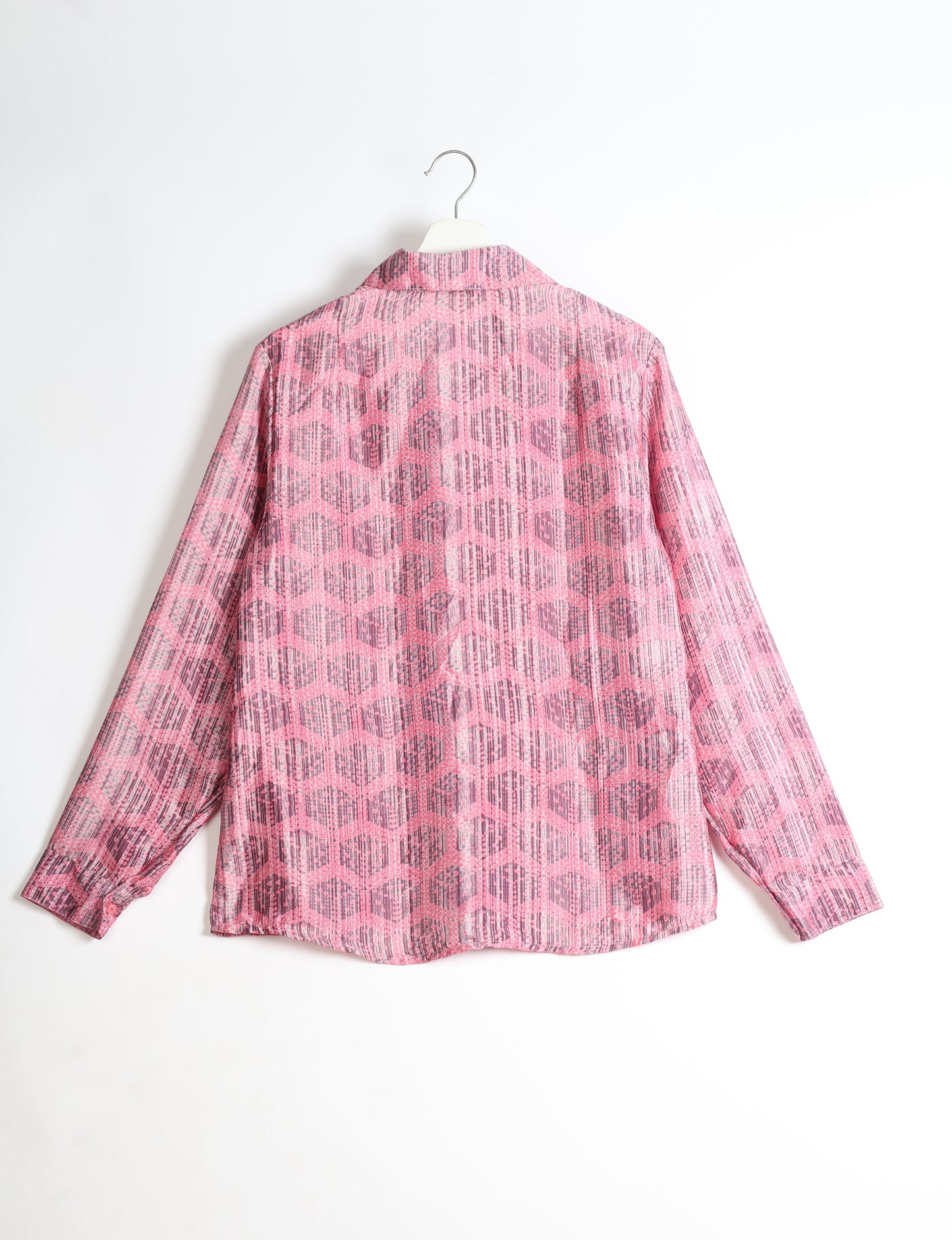 Experience sustainable fashion with our classic slim-fit shirt, crafted with ethical and green values. The shirt, designed for minimal waste, features a tie-up waist belt or neck tie, semi-spread collar, and regular shirt cuffs. Versatile and eco-friendly, wear it tucked in, unbuttoned over a tank top, or knotted at the waist for a unique style.