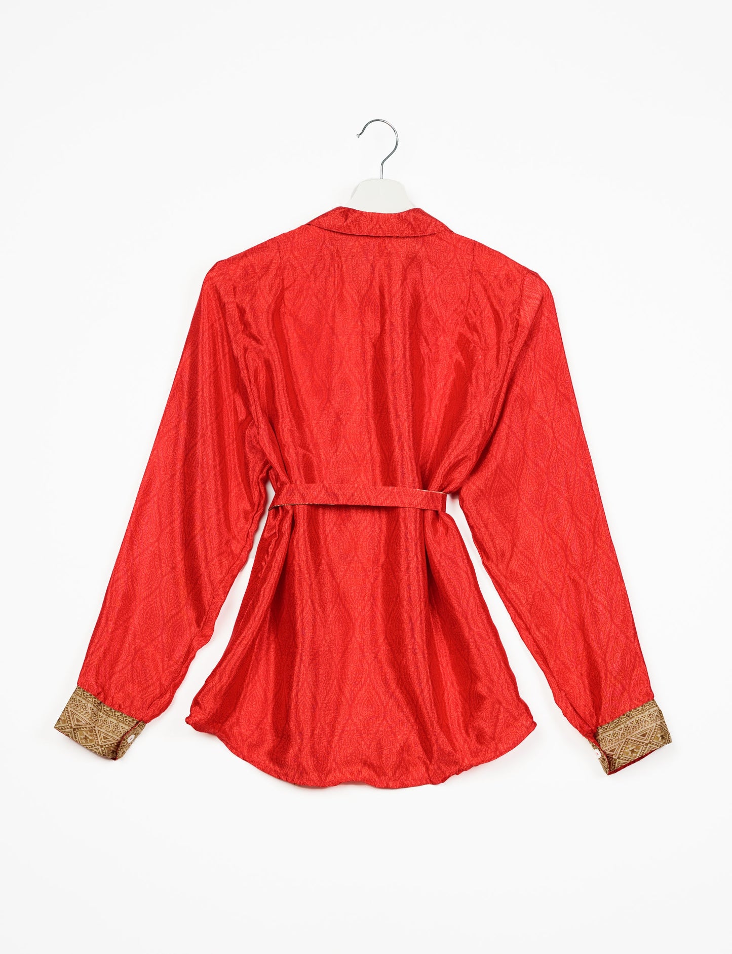 Experience sustainable fashion with our classic slim-fit shirt, crafted with ethical and green values. The shirt, designed for minimal waste, features a tie-up waist belt or neck tie, semi-spread collar, and regular shirt cuffs. Versatile and eco-friendly, wear it tucked in, unbuttoned over a tank top, or knotted at the waist for a unique style.