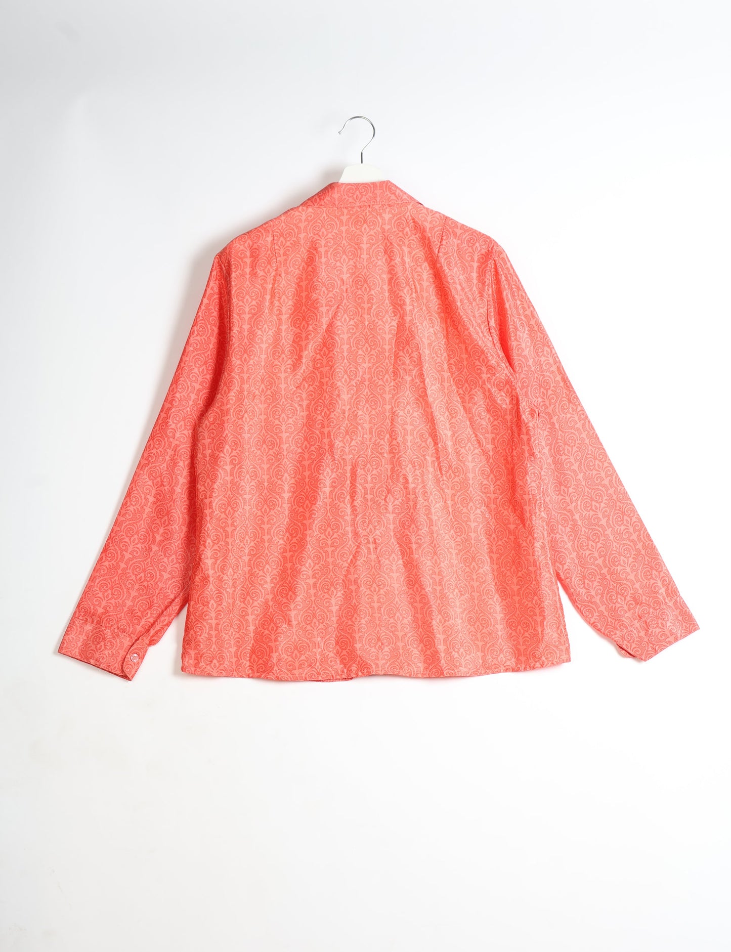 Experience sustainable fashion with our classic slim-fit shirt, crafted with ethical and green values. The shirt, designed for minimal waste, features a tie-up waist belt or neck tie, semi-spread collar, and regular shirt cuffs. Versatile and eco-friendly, wear it tucked in, unbuttoned over a tank top, or knotted at the waist for a unique style.