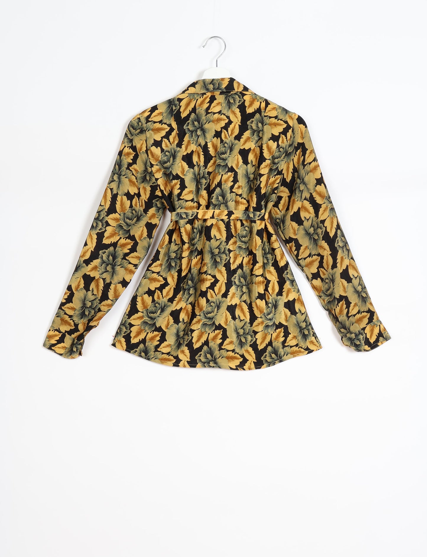 Experience sustainable fashion with our classic slim-fit shirt, crafted with ethical and green values. The shirt, designed for minimal waste, features a tie-up waist belt or neck tie, semi-spread collar, and regular shirt cuffs. Versatile and eco-friendly, wear it tucked in, unbuttoned over a tank top, or knotted at the waist for a unique style.