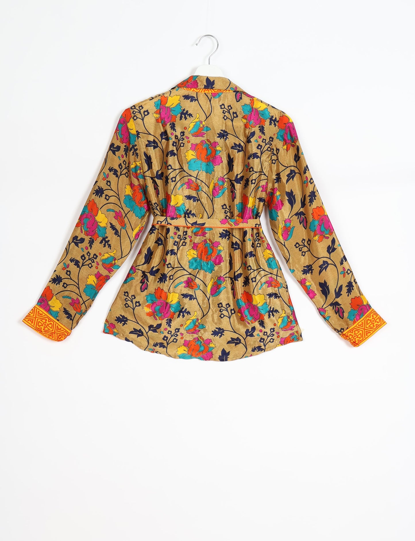 Experience sustainable fashion with our classic slim-fit shirt, crafted with ethical and green values. The shirt, designed for minimal waste, features a tie-up waist belt or neck tie, semi-spread collar, and regular shirt cuffs. Versatile and eco-friendly, wear it tucked in, unbuttoned over a tank top, or knotted at the waist for a unique style.