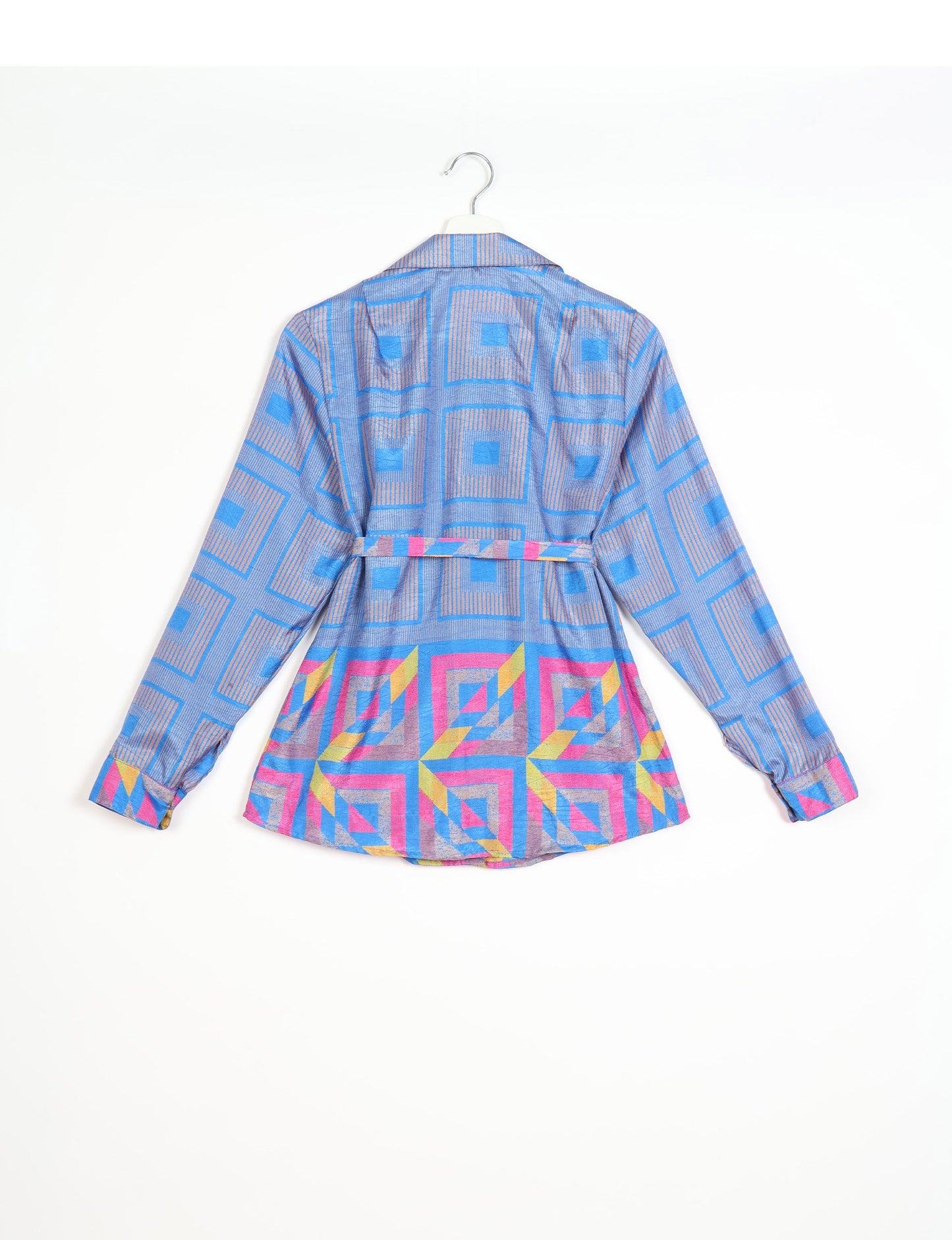 Experience sustainable fashion with our classic slim-fit shirt, crafted with ethical and green values. The shirt, designed for minimal waste, features a tie-up waist belt or neck tie, semi-spread collar, and regular shirt cuffs. Versatile and eco-friendly, wear it tucked in, unbuttoned over a tank top, or knotted at the waist for a unique style.