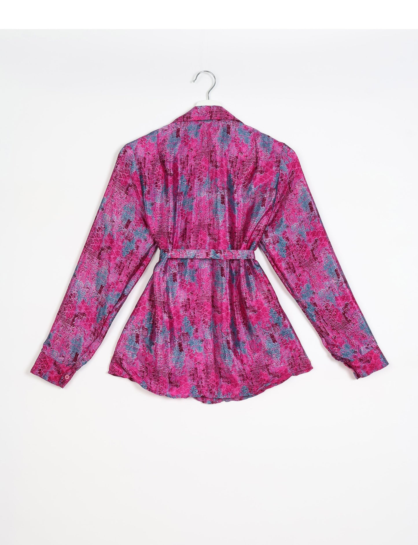 Experience sustainable fashion with our classic slim-fit shirt, crafted with ethical and green values. The shirt, designed for minimal waste, features a tie-up waist belt or neck tie, semi-spread collar, and regular shirt cuffs. Versatile and eco-friendly, wear it tucked in, unbuttoned over a tank top, or knotted at the waist for a unique style.