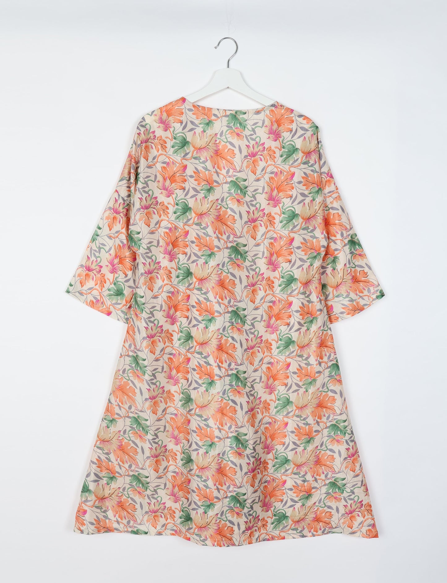 Elevate your style with our Sunset Coat, a shin-length wrap featuring a deep V-neck, wide flared 3/4 sleeves, and side tie with thread tassels. Embrace ethical and sustainable fashion with this zero waste, upcycled garment. A perfect blend of elegance and whimsy for conscious clothing enthusiasts.