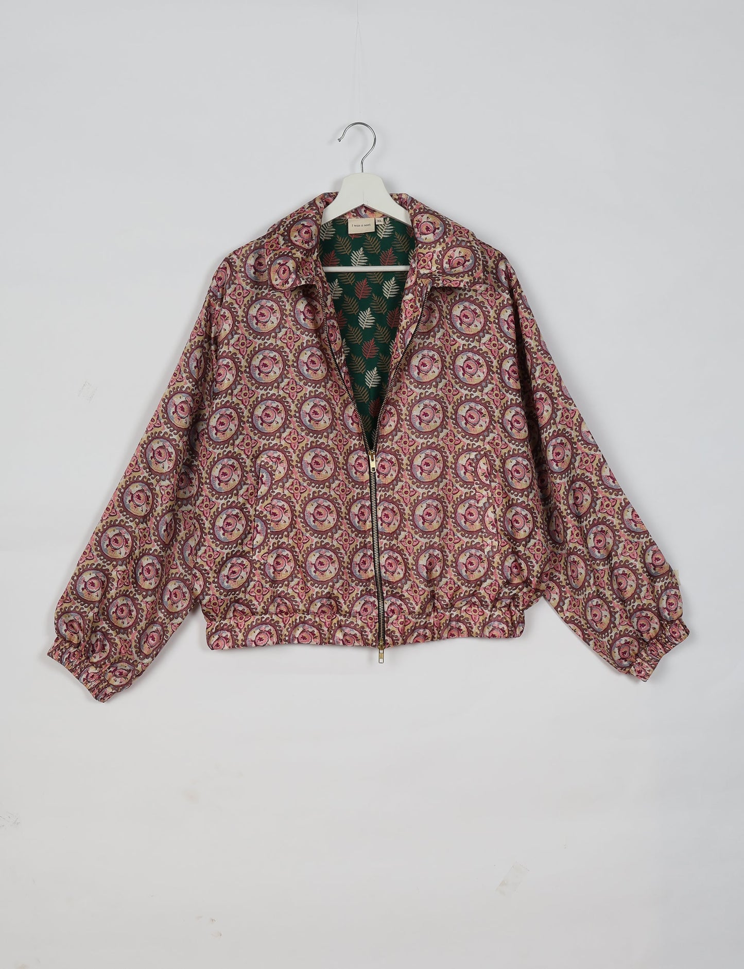 Upcycled Bomber Jacket made from recycled sari materials, featuring a cute cropped shape, elasticated hem and cuffs, and contrast sari print lining. Sustainable apparel promoting eco-friendly fashion and ethical clothing.