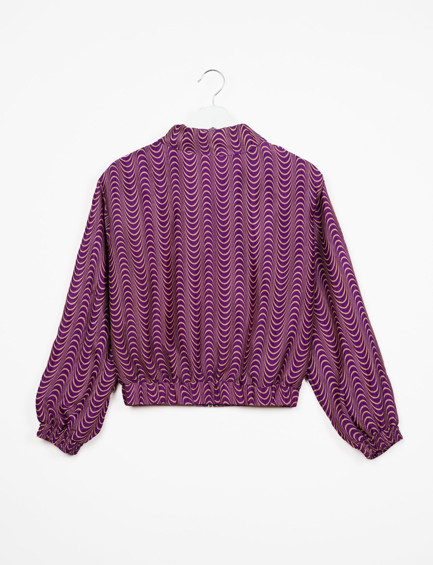 Stylish BOMBER JACKET, an upcycled clothing masterpiece with a cute cropped shape, elasticated details, and detachable metallic zipper. Contrast sari print lining adds a unique touch. Explore sustainable and eco-friendly fashion.