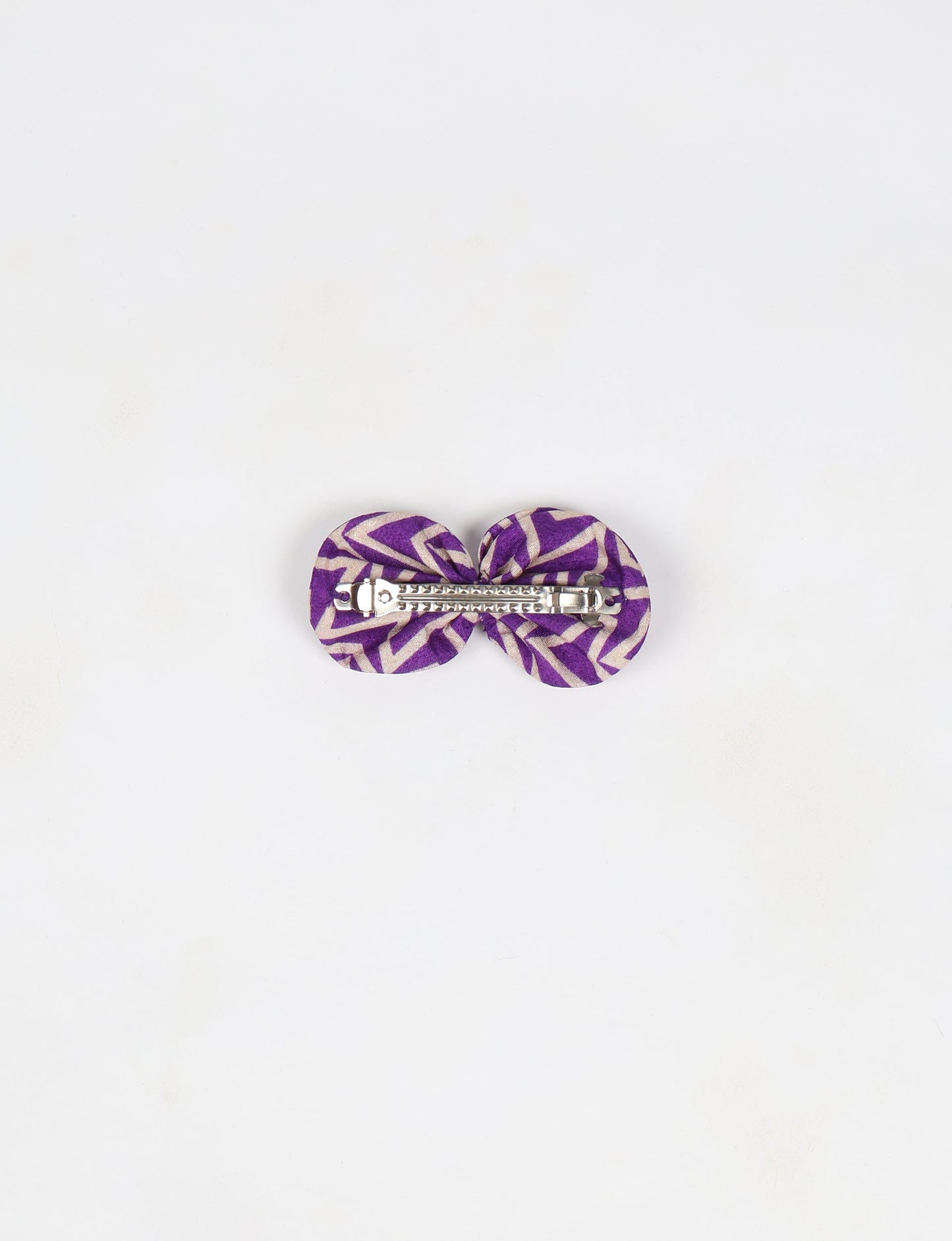 Stylish upcycled women's hairclip made from eco friendly products, reflecting the essence of upcycling fashion, ethical clothing, and sustainable apparel—ideal for those embracing slow fashion and earth friendly clothing.