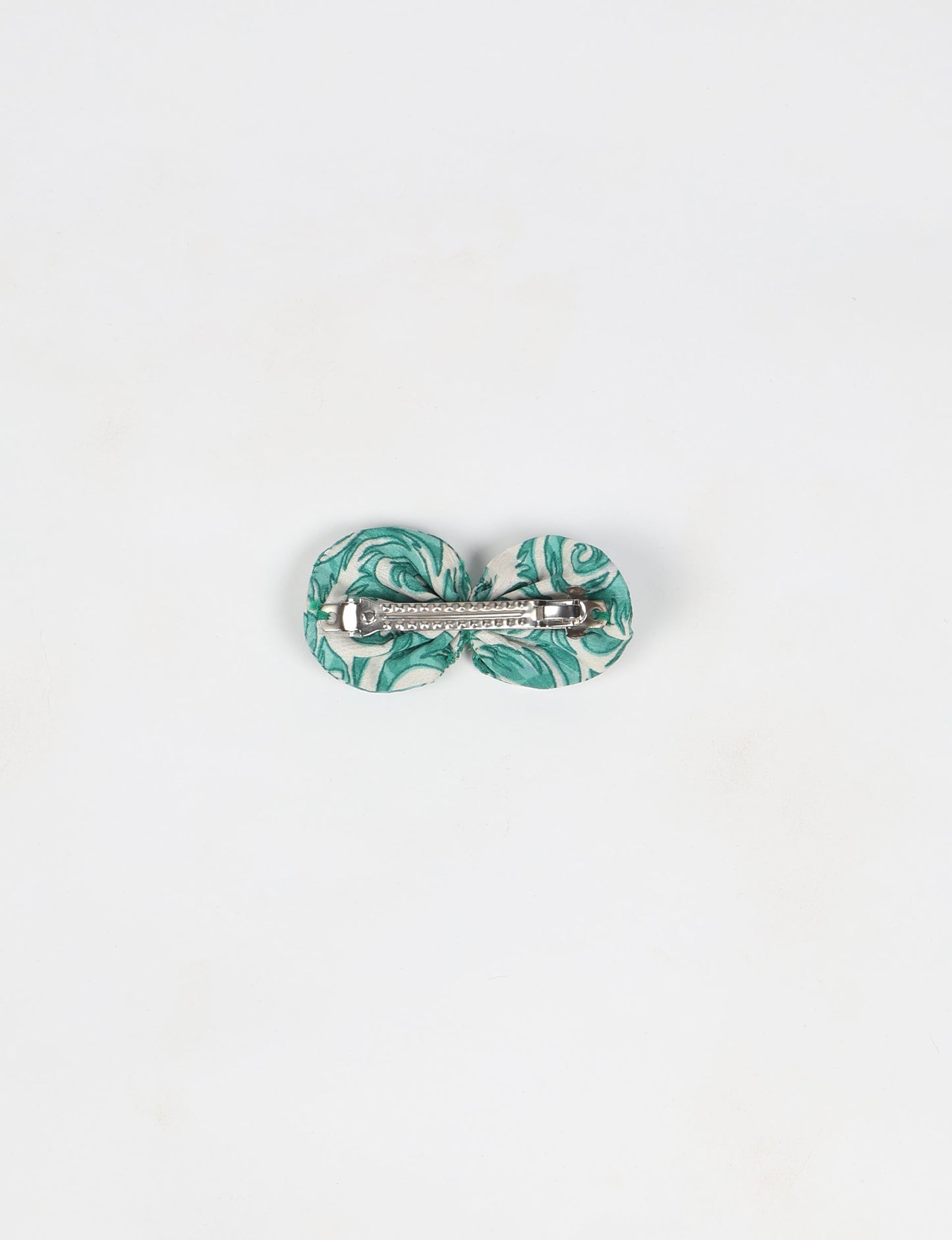 Stylish upcycled women's hairclip made from eco friendly products, reflecting the essence of upcycling fashion, ethical clothing, and sustainable apparel—ideal for those embracing slow fashion and earth friendly clothing.