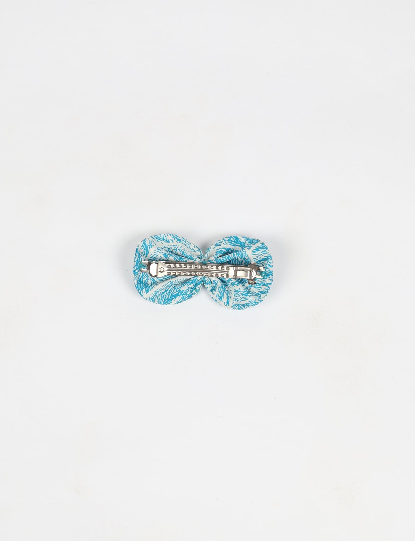Stylish upcycled women's hairclip made from eco friendly products, reflecting the essence of upcycling fashion, ethical clothing, and sustainable apparel—ideal for those embracing slow fashion and earth friendly clothing.