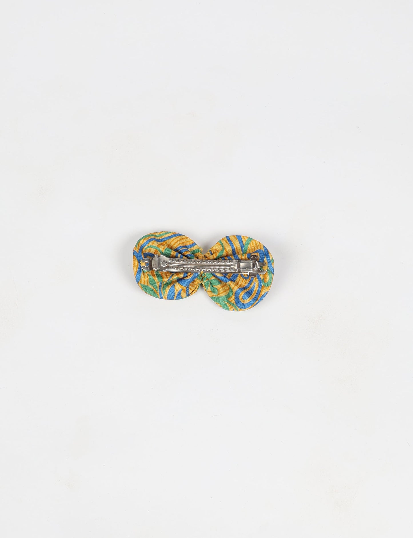 Stylish upcycled women's hairclip made from eco friendly products, reflecting the essence of upcycling fashion, ethical clothing, and sustainable apparel—ideal for those embracing slow fashion and earth friendly clothing.