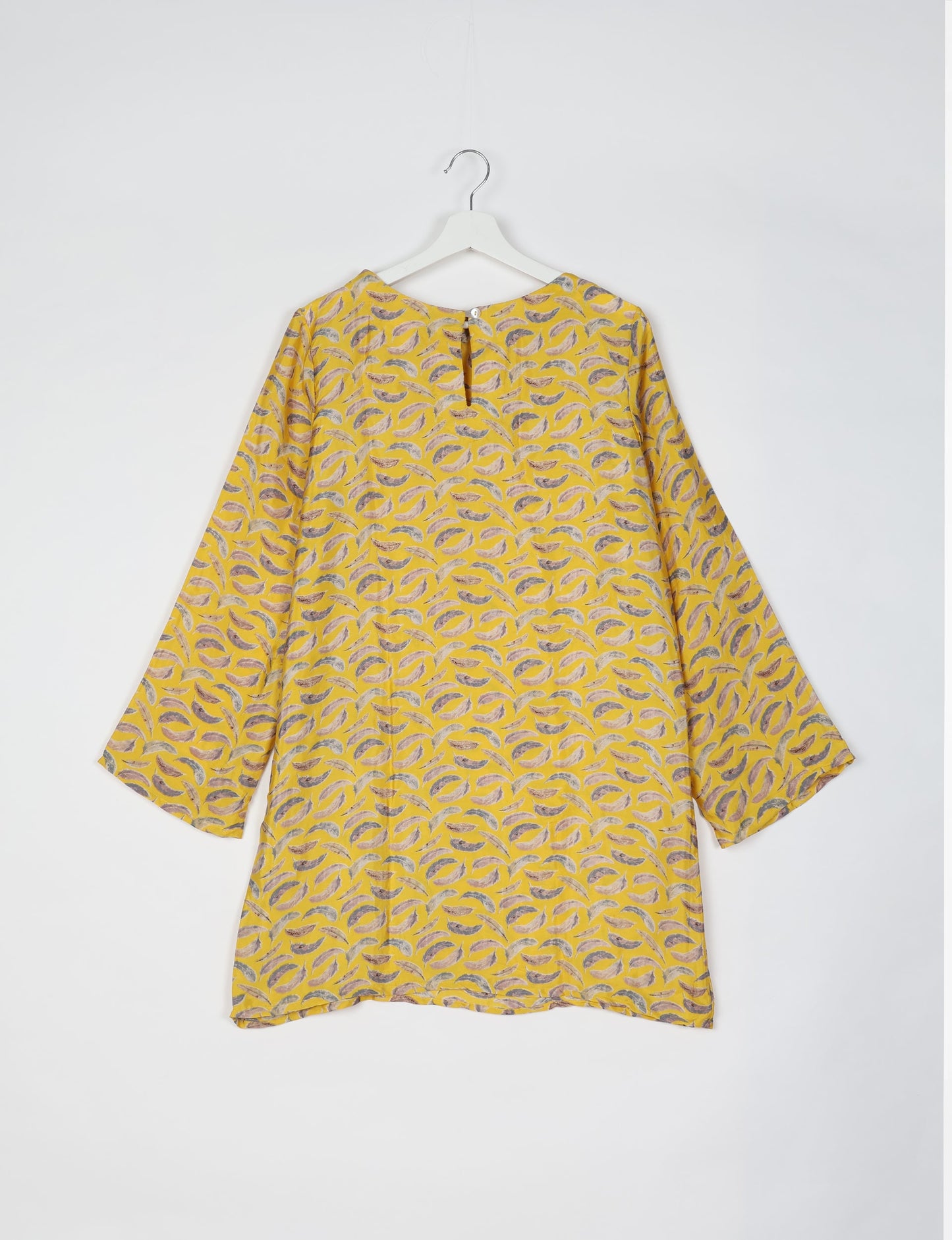 Chic and conscious, our A-line mini swing dress is a must-have in sustainable fashion. Adorned with flared sleeves, a keyhole back opening, and a mother of pearl button with twill tape loop. This zero waste, upcycled garment reflects the essence of eco-friendly and ethical clothing.