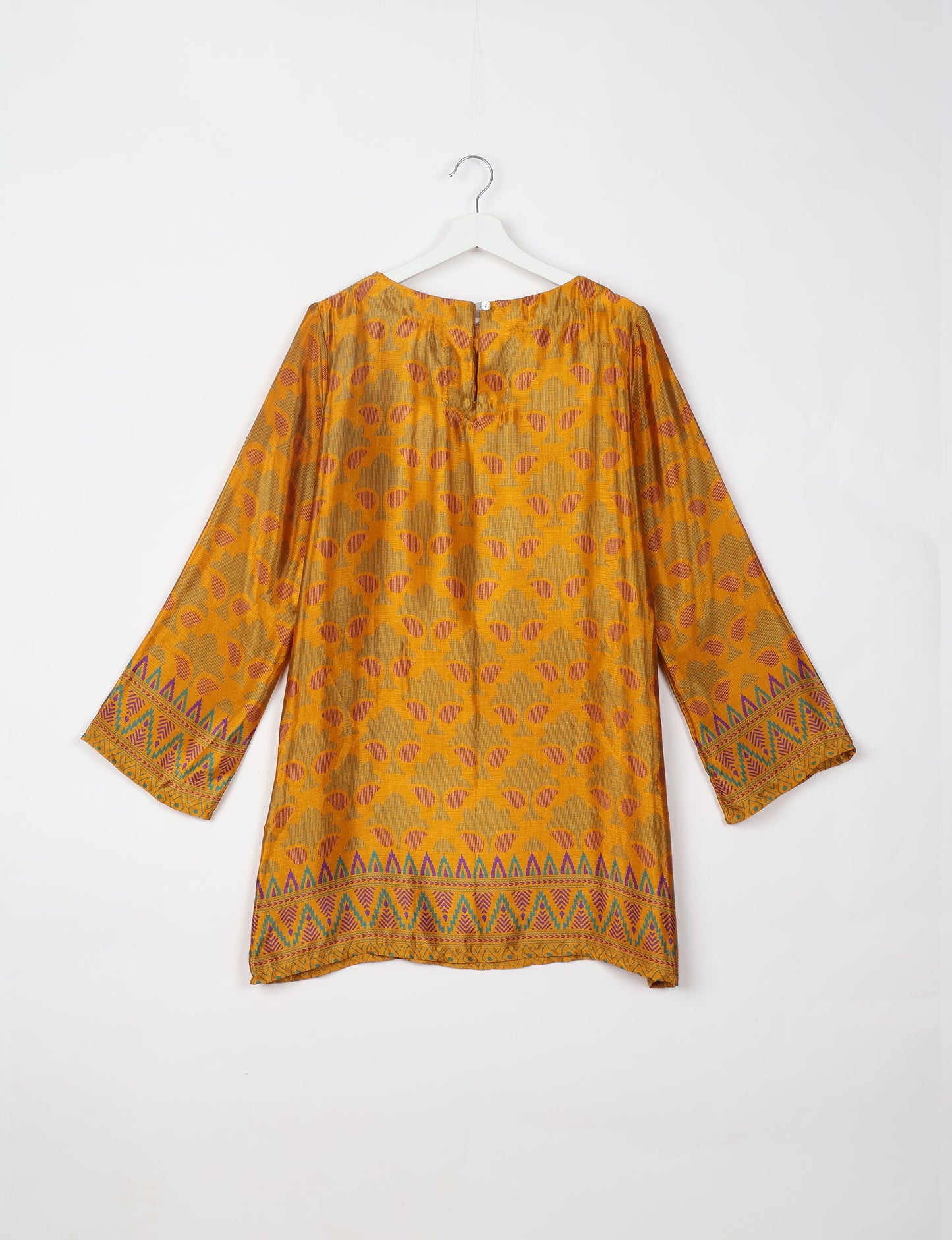 Chic and conscious, our A-line mini swing dress is a must-have in sustainable fashion. Adorned with flared sleeves, a keyhole back opening, and a mother of pearl button with twill tape loop. This zero waste, upcycled garment reflects the essence of eco-friendly and ethical clothing.