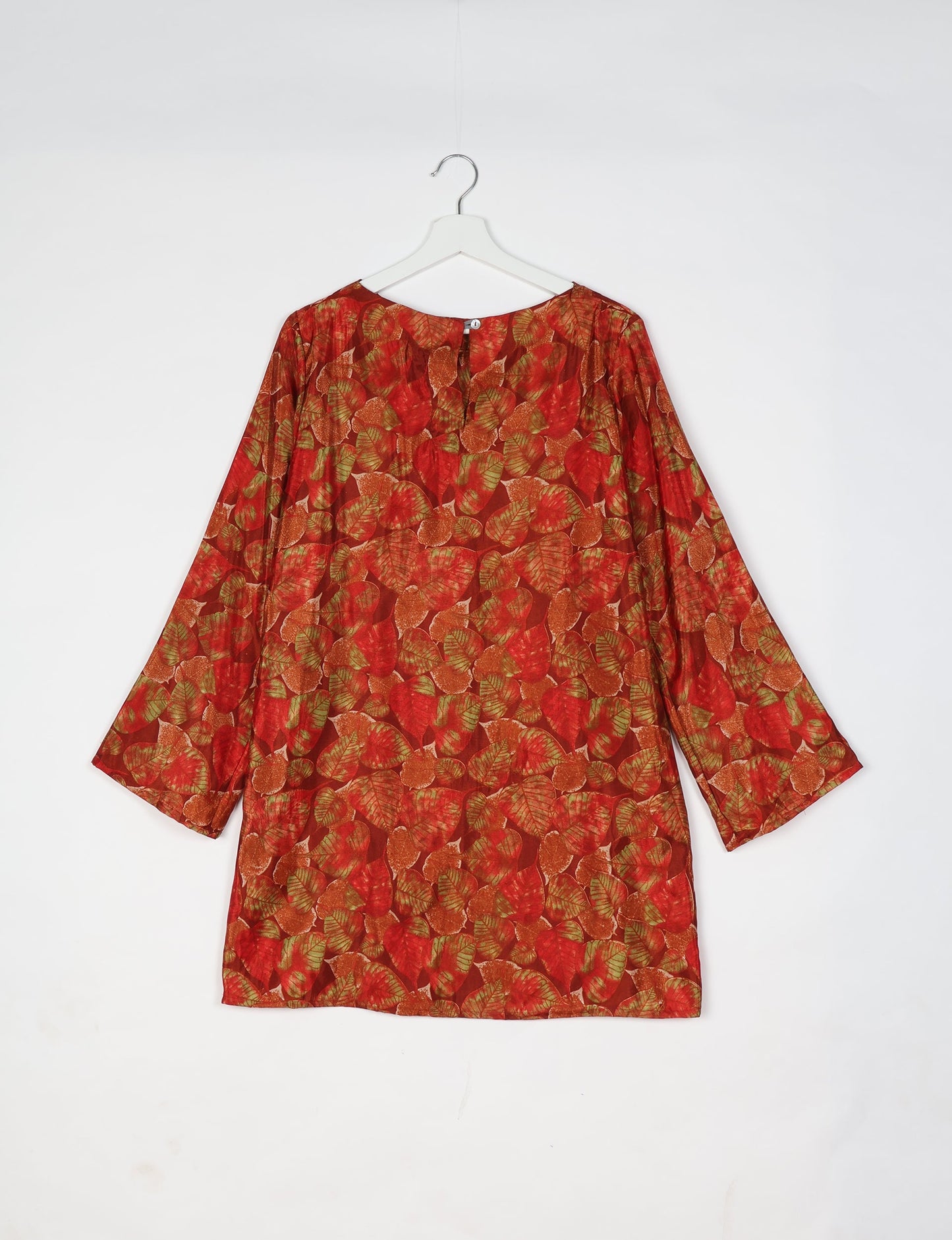 Chic and conscious, our A-line mini swing dress is a must-have in sustainable fashion. Adorned with flared sleeves, a keyhole back opening, and a mother of pearl button with twill tape loop. This zero waste, upcycled garment reflects the essence of eco-friendly and ethical clothing.