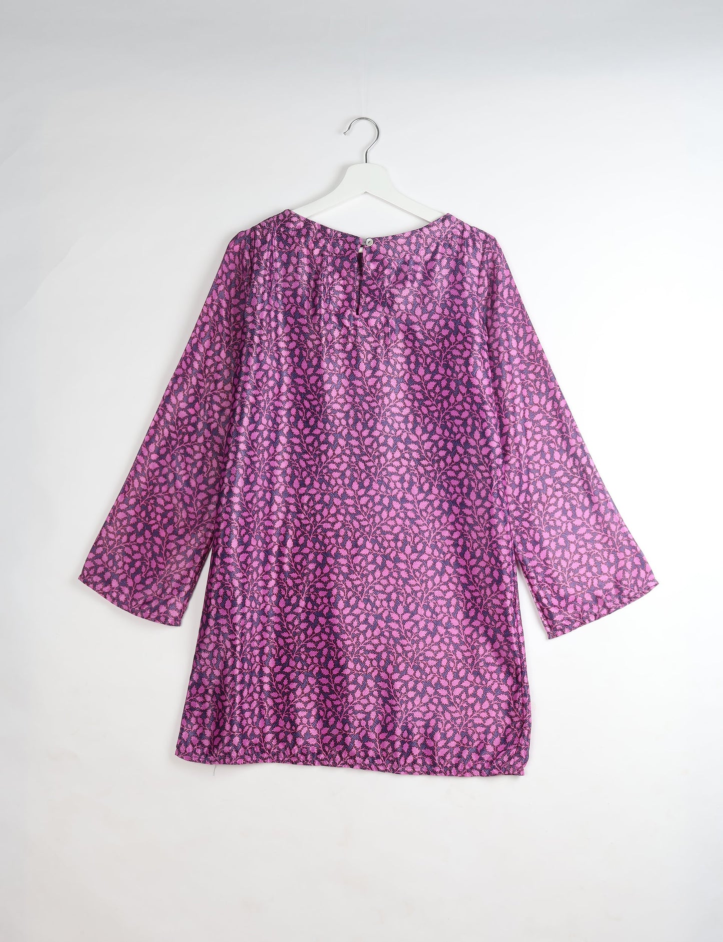 Chic and conscious, our A-line mini swing dress is a must-have in sustainable fashion. Adorned with flared sleeves, a keyhole back opening, and a mother of pearl button with twill tape loop. This zero waste, upcycled garment reflects the essence of eco-friendly and ethical clothing.