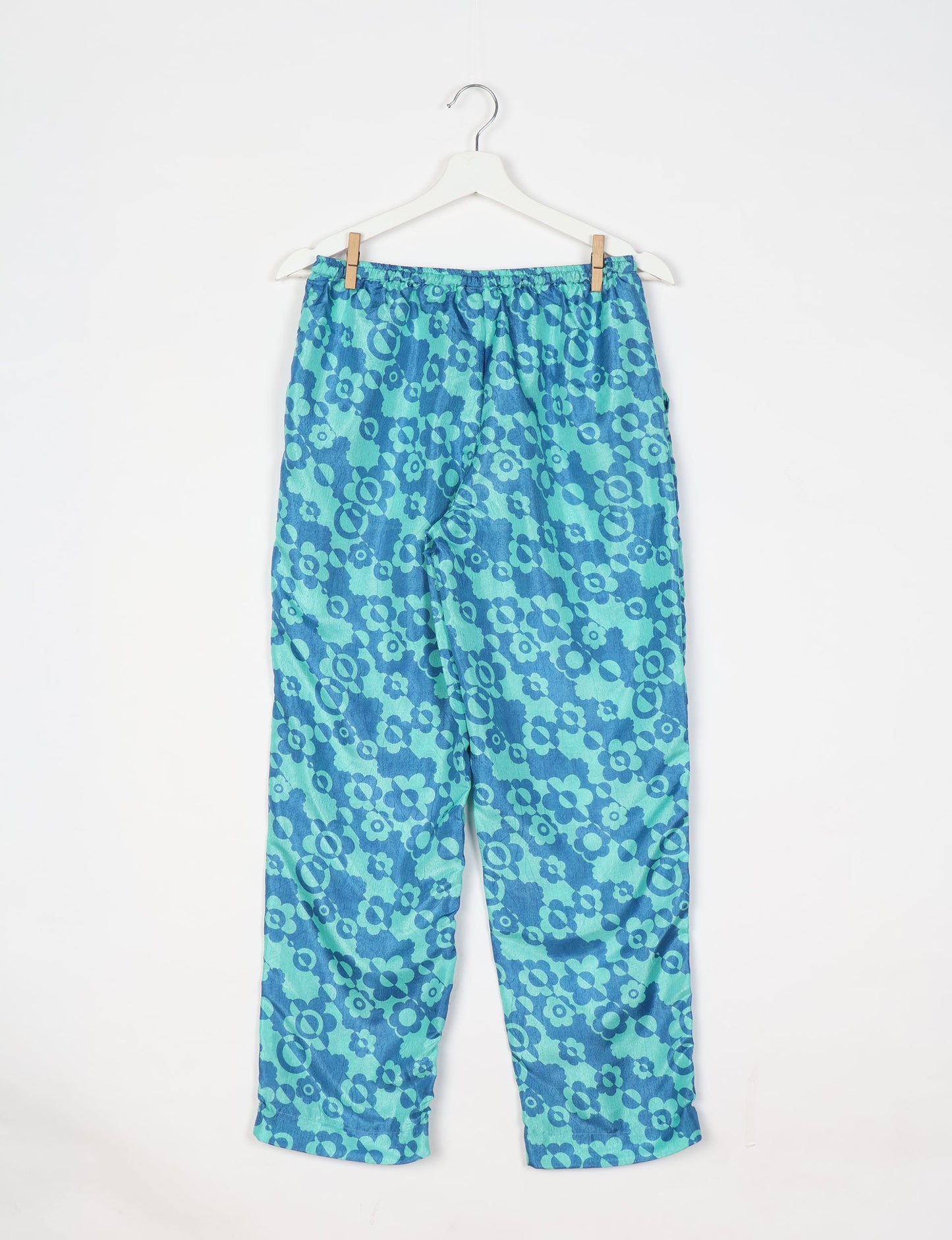 Elevate your wardrobe with our planet-friendly PULL-ON PANTS. Made from upcycled sari fabric, these eco-conscious pants offer a drawstring waist for a perfect fit. Tapered leg design ensures both style and comfort. Choose ethical, green fashion that supports artisans and sustainable living.