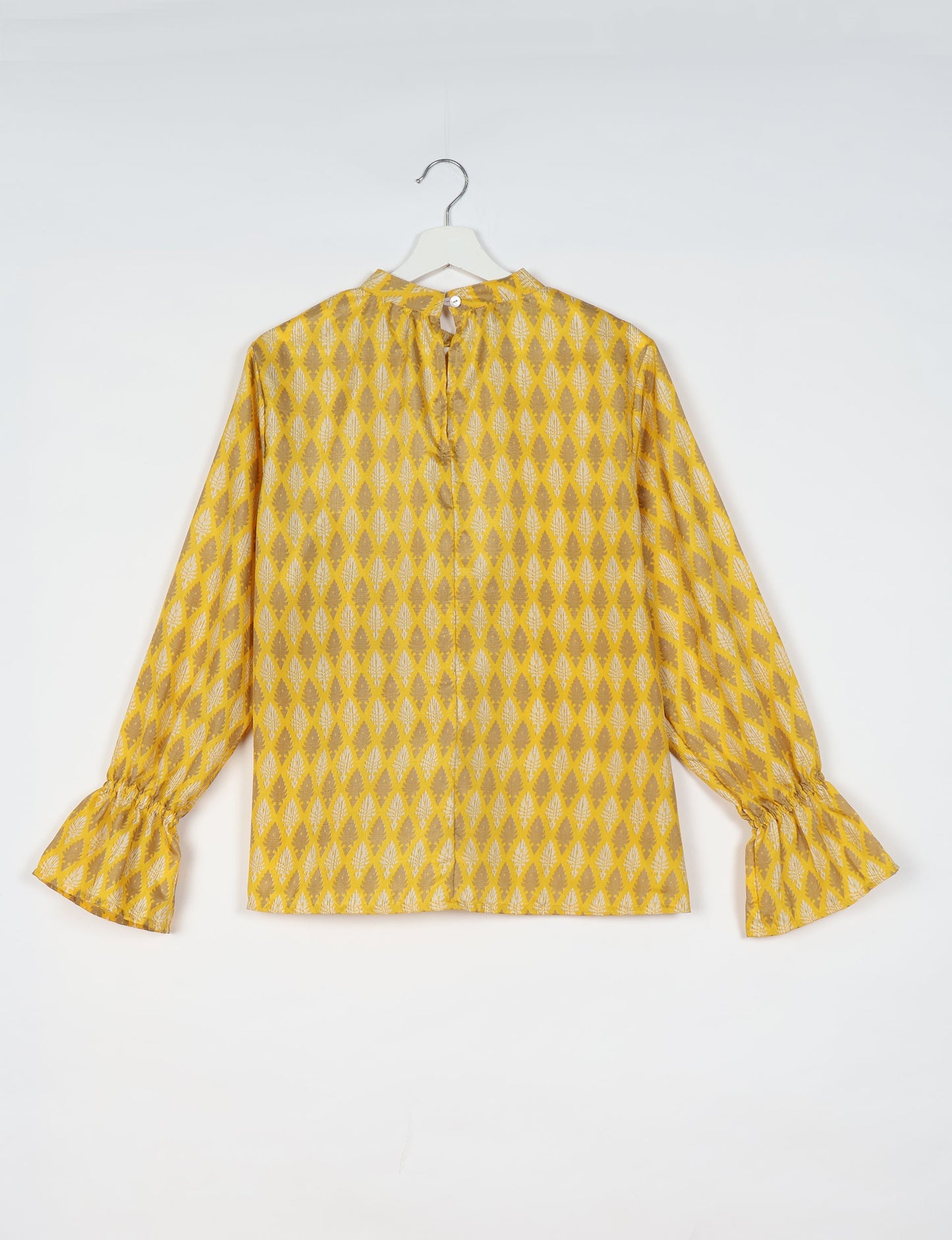 Flowing blouse with peasant sleeves and gathered neckline made from upcycled garments and repurposed clothing, showcasing eco clothing and fair trade fashion in a stylish, comfortable design.