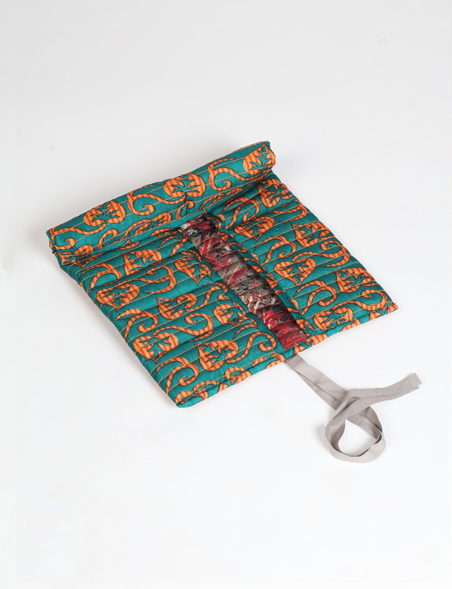 Roll-Up Organizer made from repurposed sari fabric, showcasing compact design and sustainable fashion innovation.