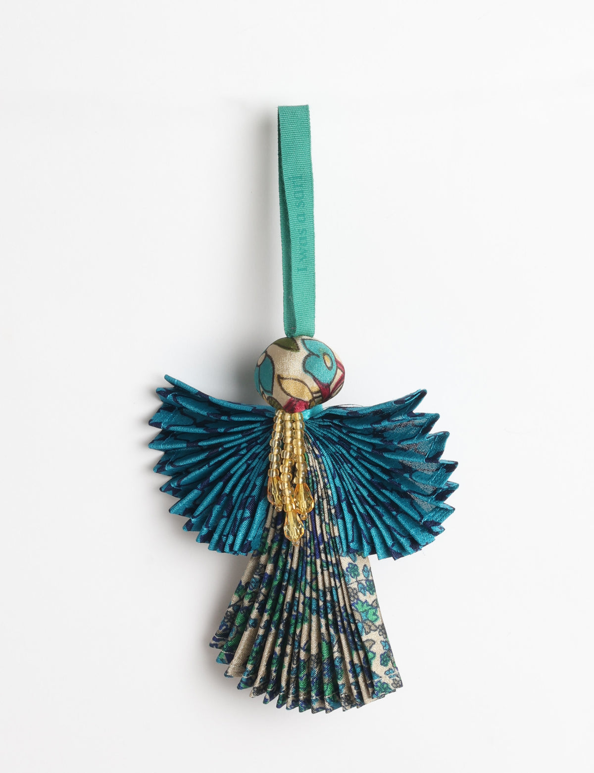 Angel Christmas Ornament made from upcycled saris, featuring pleated arms and body. A sustainable, eco-friendly holiday decoration, embodying recycled fashion and upcycling in festive style.