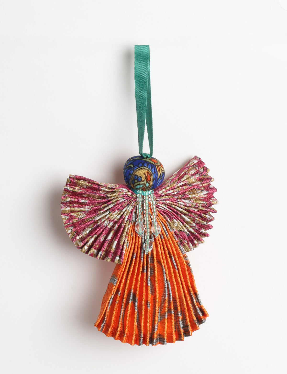 Angel Christmas Ornament made from upcycled saris, featuring pleated arms and body. A sustainable, eco-friendly holiday decoration, embodying recycled fashion and upcycling in festive style.