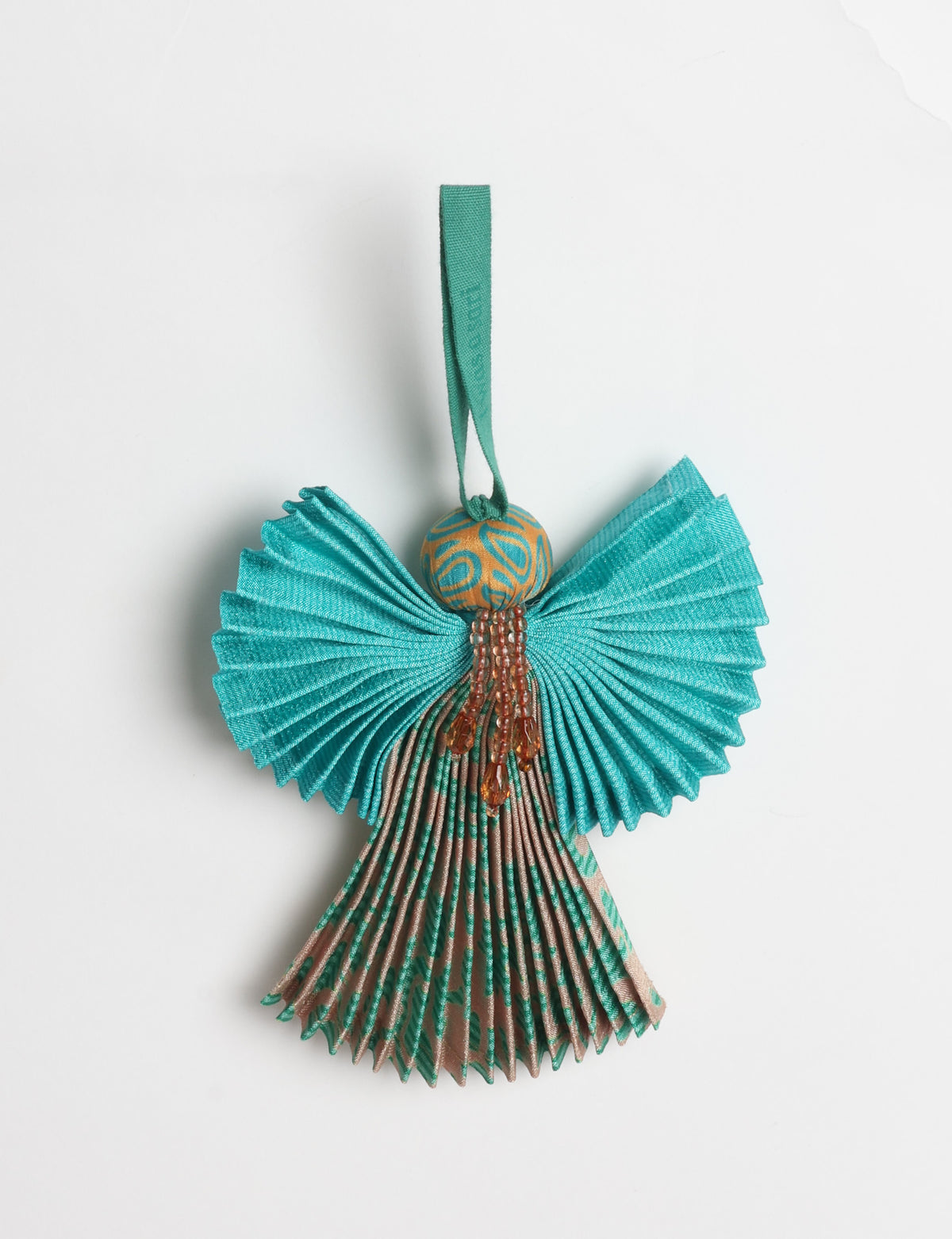 Angel Christmas Ornament made from upcycled saris, featuring pleated arms and body. A sustainable, eco-friendly holiday decoration, embodying recycled fashion and upcycling in festive style.