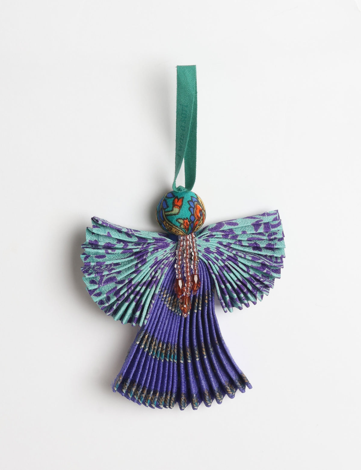 Angel Christmas Ornament made from upcycled saris, featuring pleated arms and body. A sustainable, eco-friendly holiday decoration, embodying recycled fashion and upcycling in festive style.