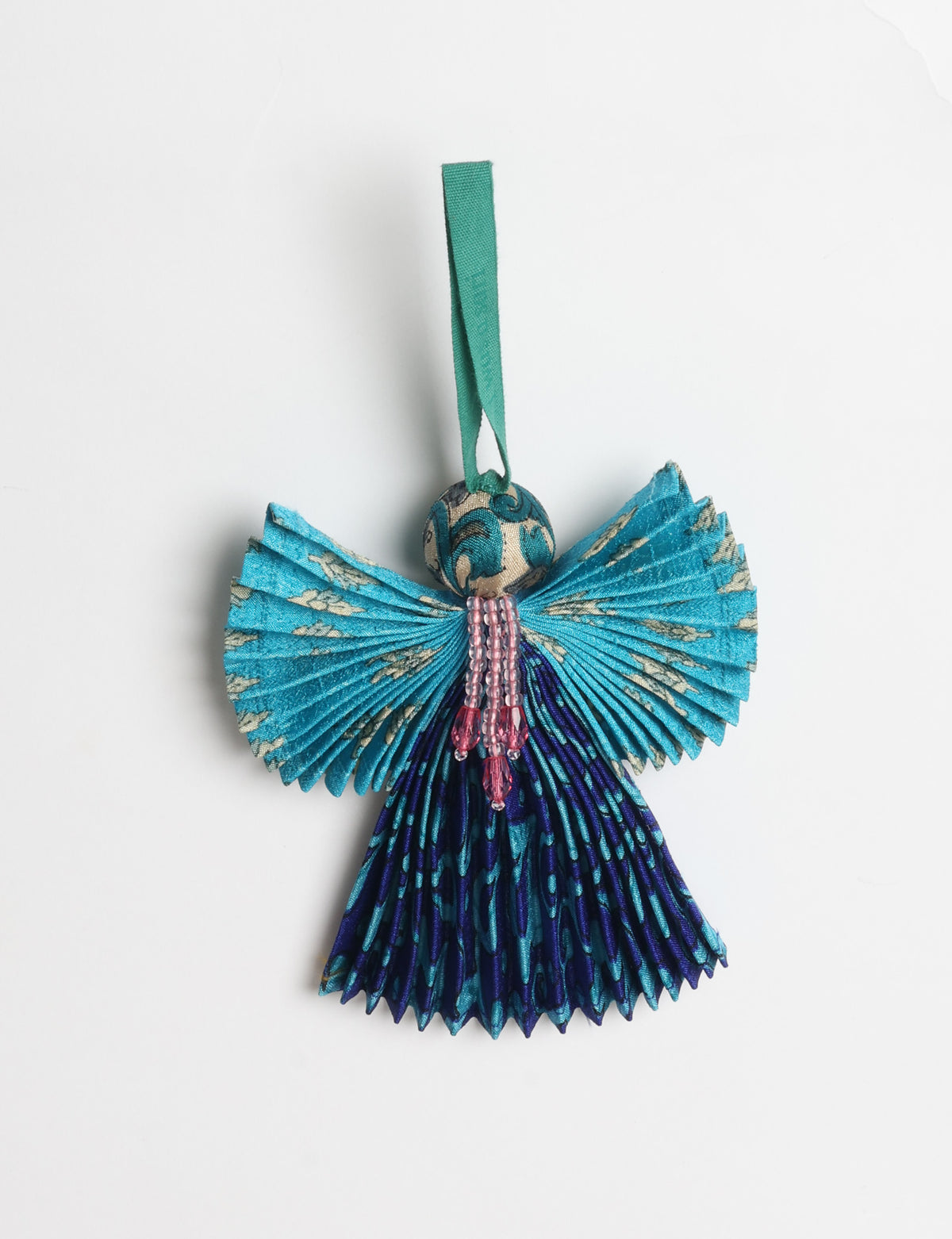 Angel Christmas Ornament made from upcycled saris, featuring pleated arms and body. A sustainable, eco-friendly holiday decoration, embodying recycled fashion and upcycling in festive style.