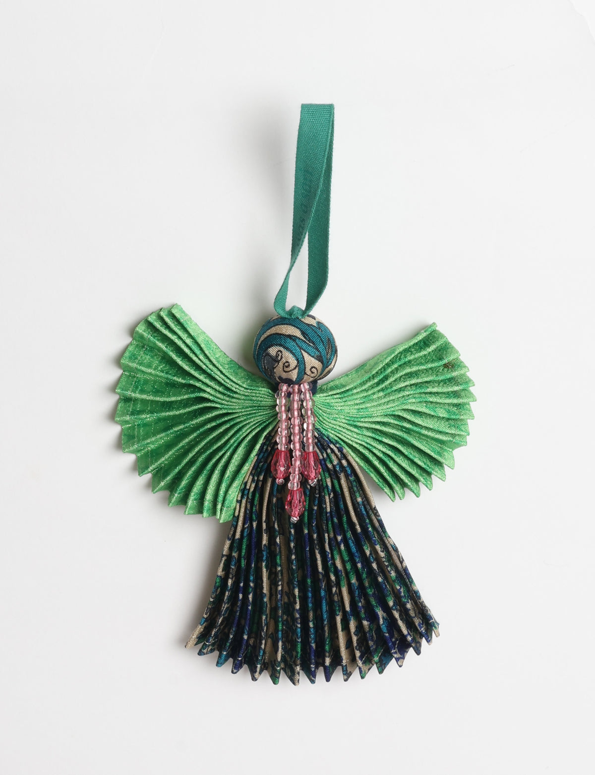 Angel Christmas Ornament made from upcycled saris, featuring pleated arms and body. A sustainable, eco-friendly holiday decoration, embodying recycled fashion and upcycling in festive style.