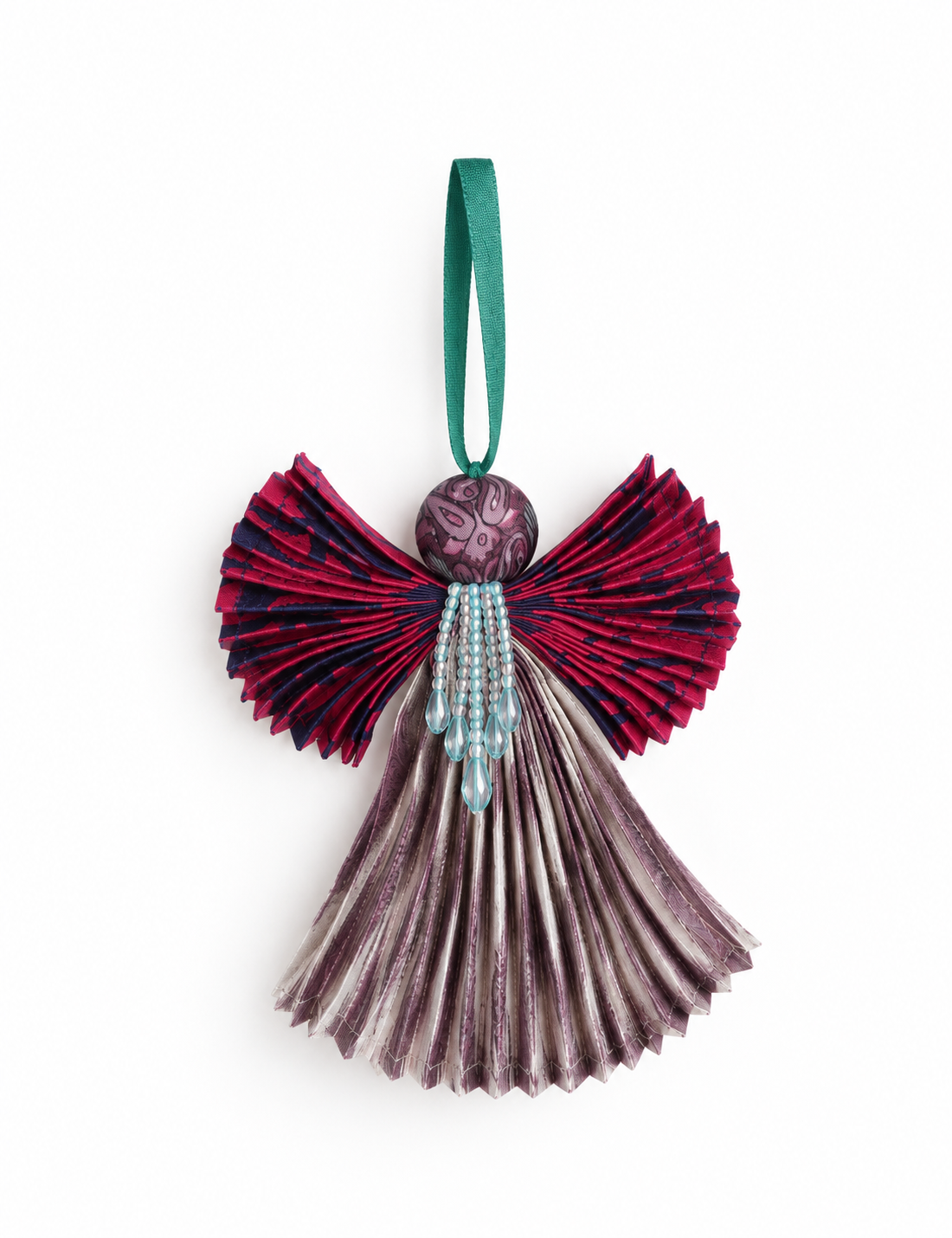 Angel Christmas Ornament made from upcycled saris, featuring pleated arms and body. A sustainable, eco-friendly holiday decoration, embodying recycled fashion and upcycling in festive style.