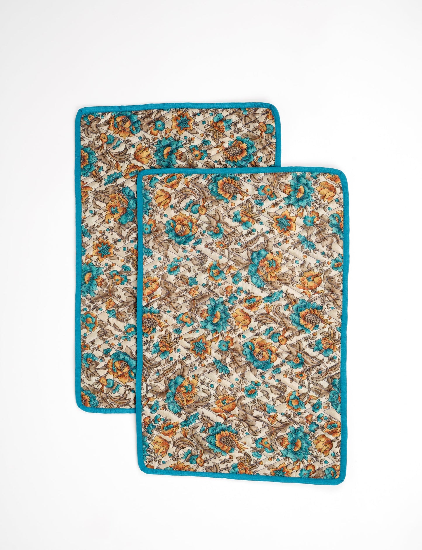 Quilted rectangular placement set of 2 made from upcycled saris and cotton canvas, eco-friendly dining accessories for ethical consumers.