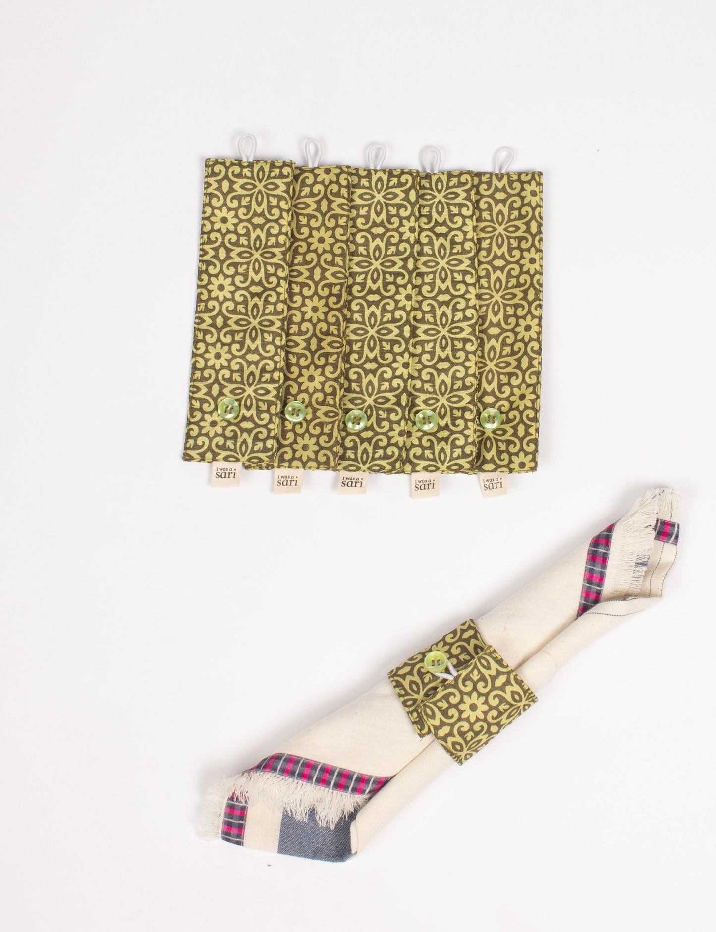 A set of 6 napkin rings made from repurposed saris, showcasing the beauty of sustainable fashion and upcycled materials. These stylish, eco-friendly rings with button closures are ideal for adding a touch of environmentally conscious elegance to your dining table.