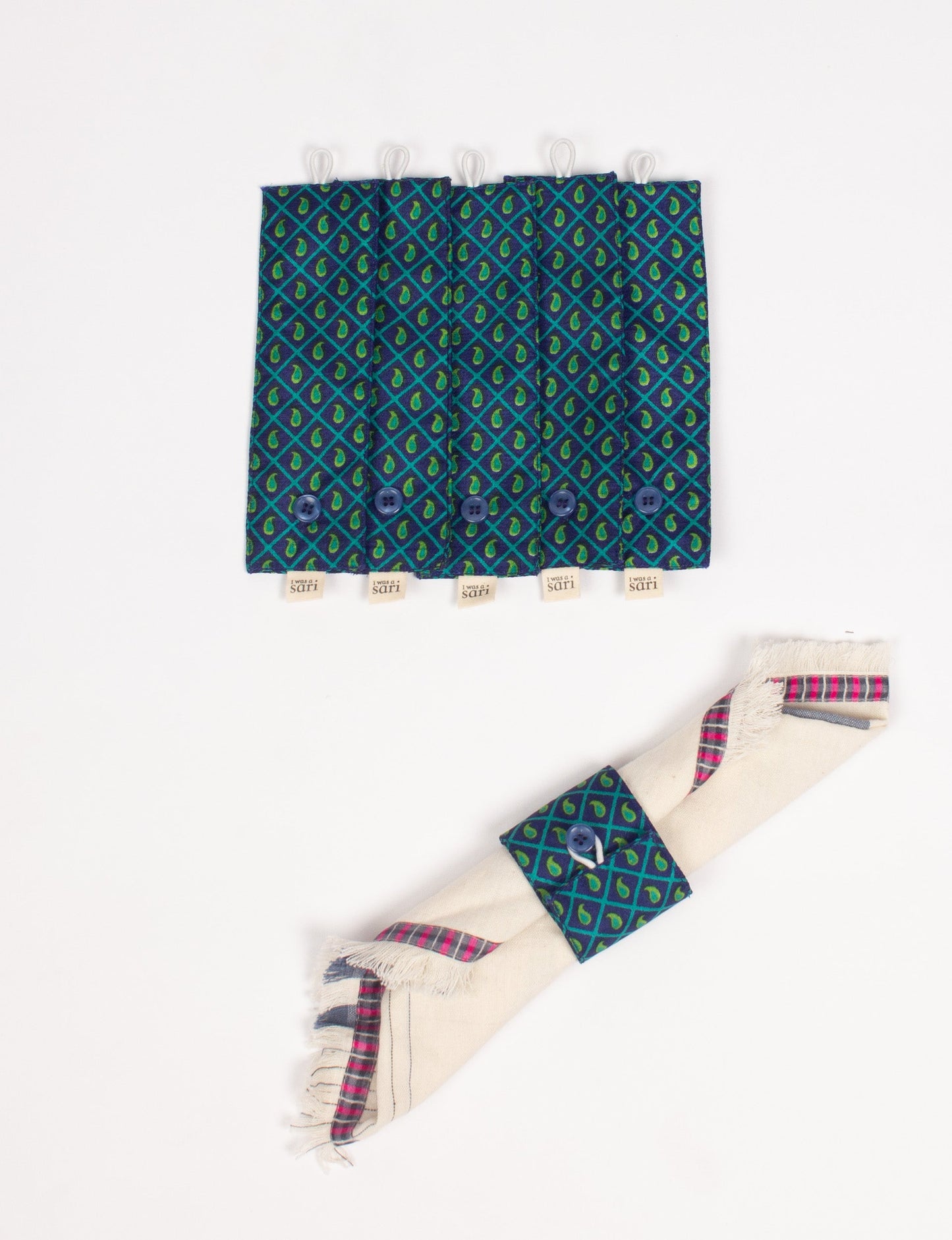 A set of 6 napkin rings made from repurposed saris, showcasing the beauty of sustainable fashion and upcycled materials. These stylish, eco-friendly rings with button closures are ideal for adding a touch of environmentally conscious elegance to your dining table.