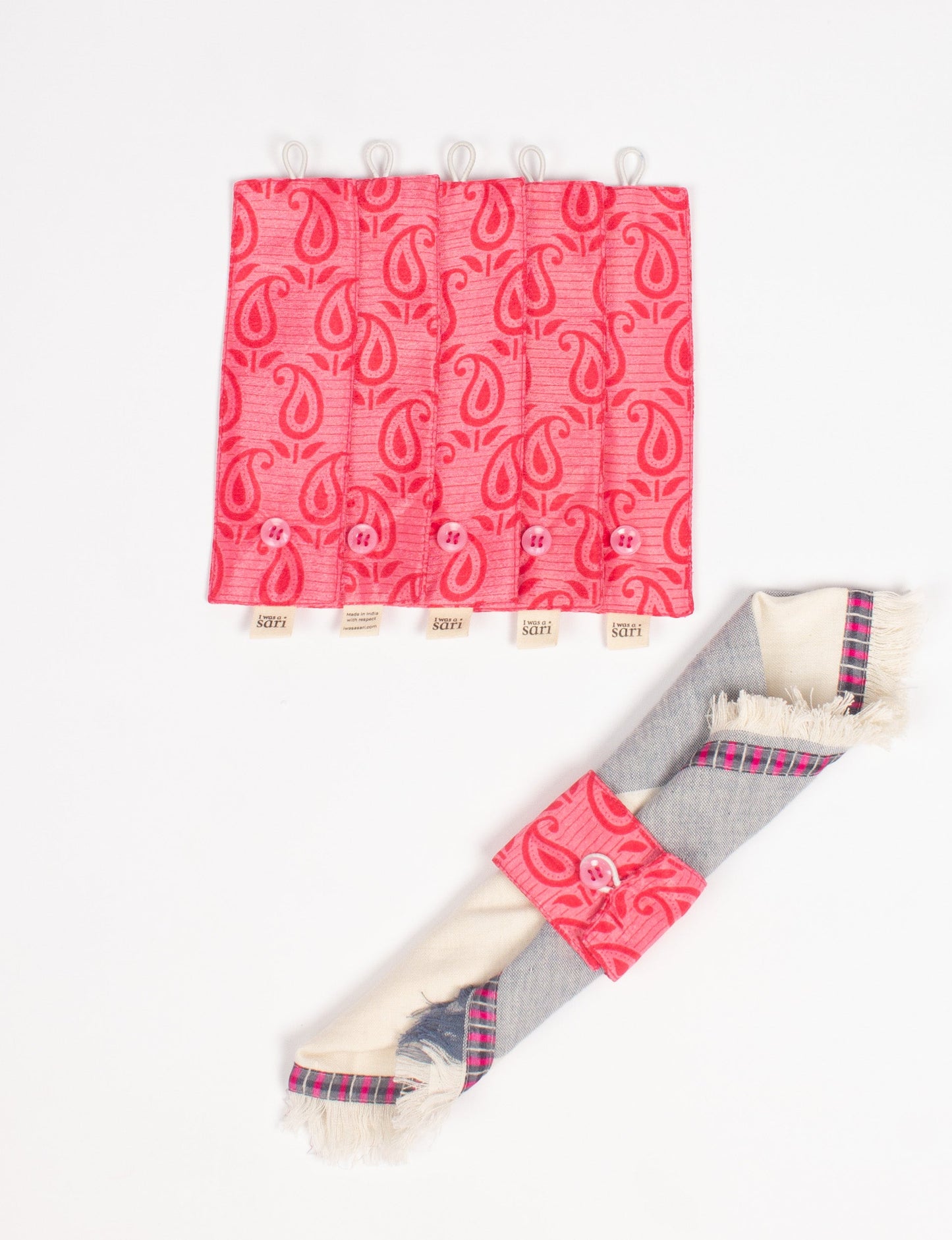 A set of 6 napkin rings made from repurposed saris, showcasing the beauty of sustainable fashion and upcycled materials. These stylish, eco-friendly rings with button closures are ideal for adding a touch of environmentally conscious elegance to your dining table.