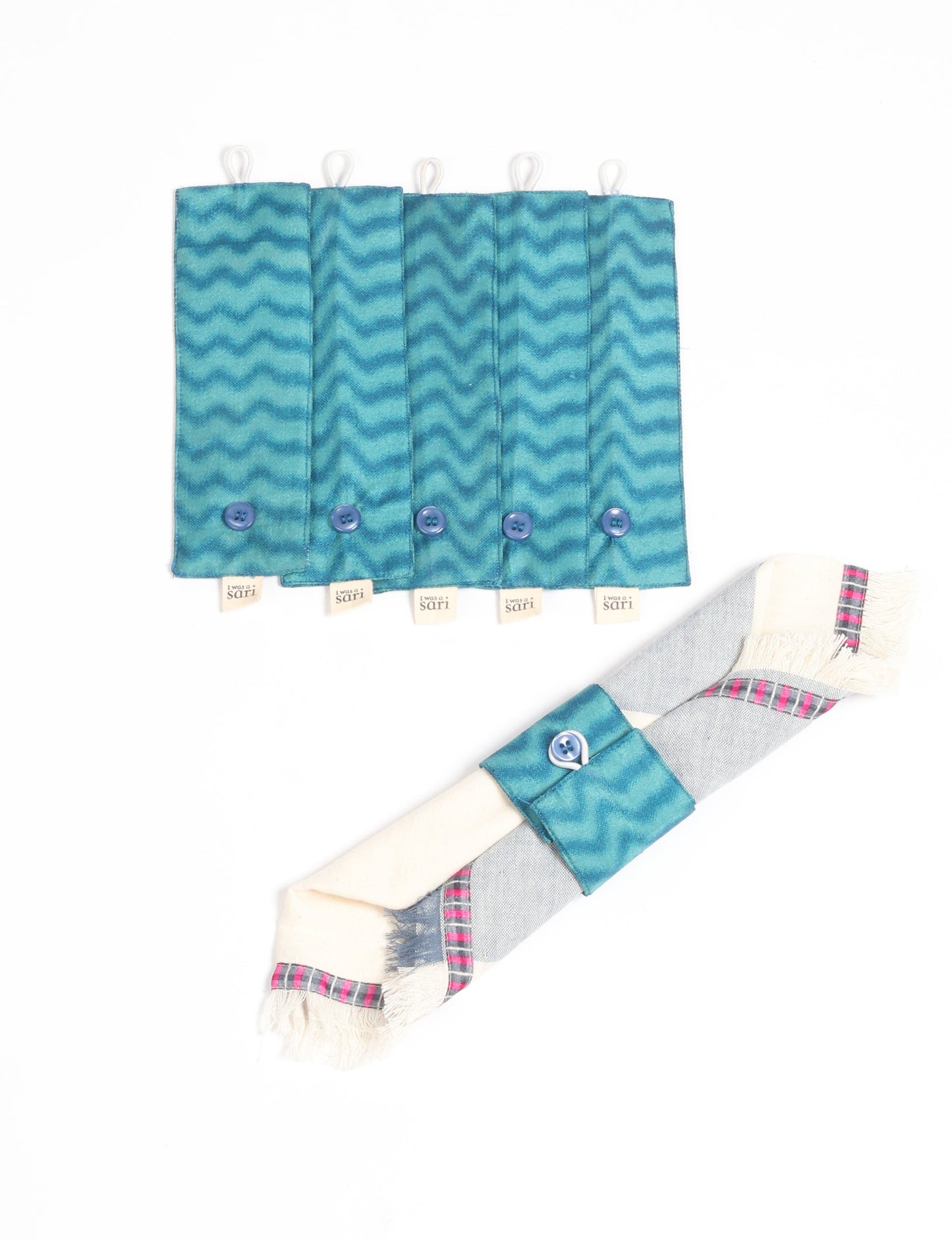 A set of 6 napkin rings made from repurposed saris, showcasing the beauty of sustainable fashion and upcycled materials. These stylish, eco-friendly rings with button closures are ideal for adding a touch of environmentally conscious elegance to your dining table.
