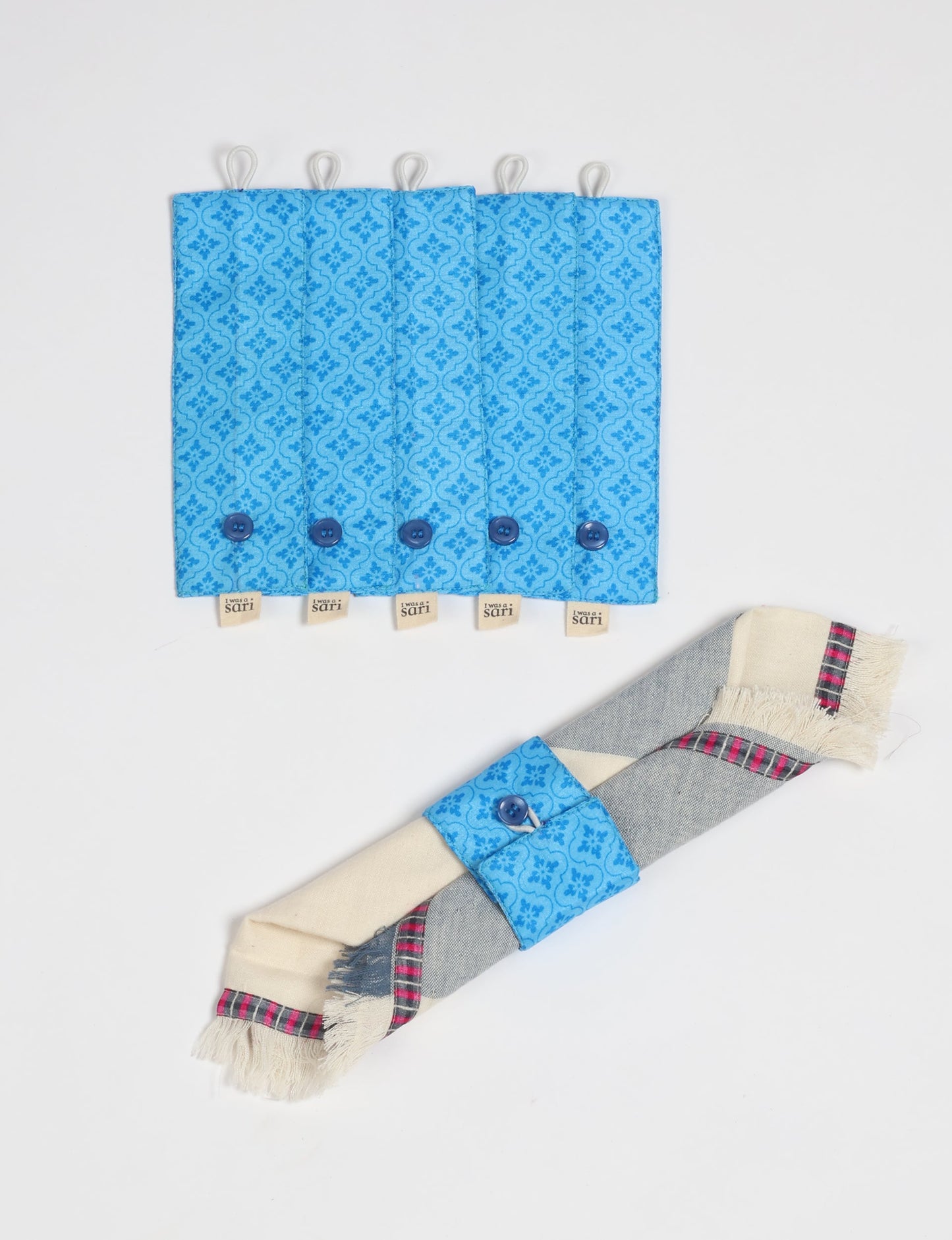 A set of 6 napkin rings made from repurposed saris, showcasing the beauty of sustainable fashion and upcycled materials. These stylish, eco-friendly rings with button closures are ideal for adding a touch of environmentally conscious elegance to your dining table.