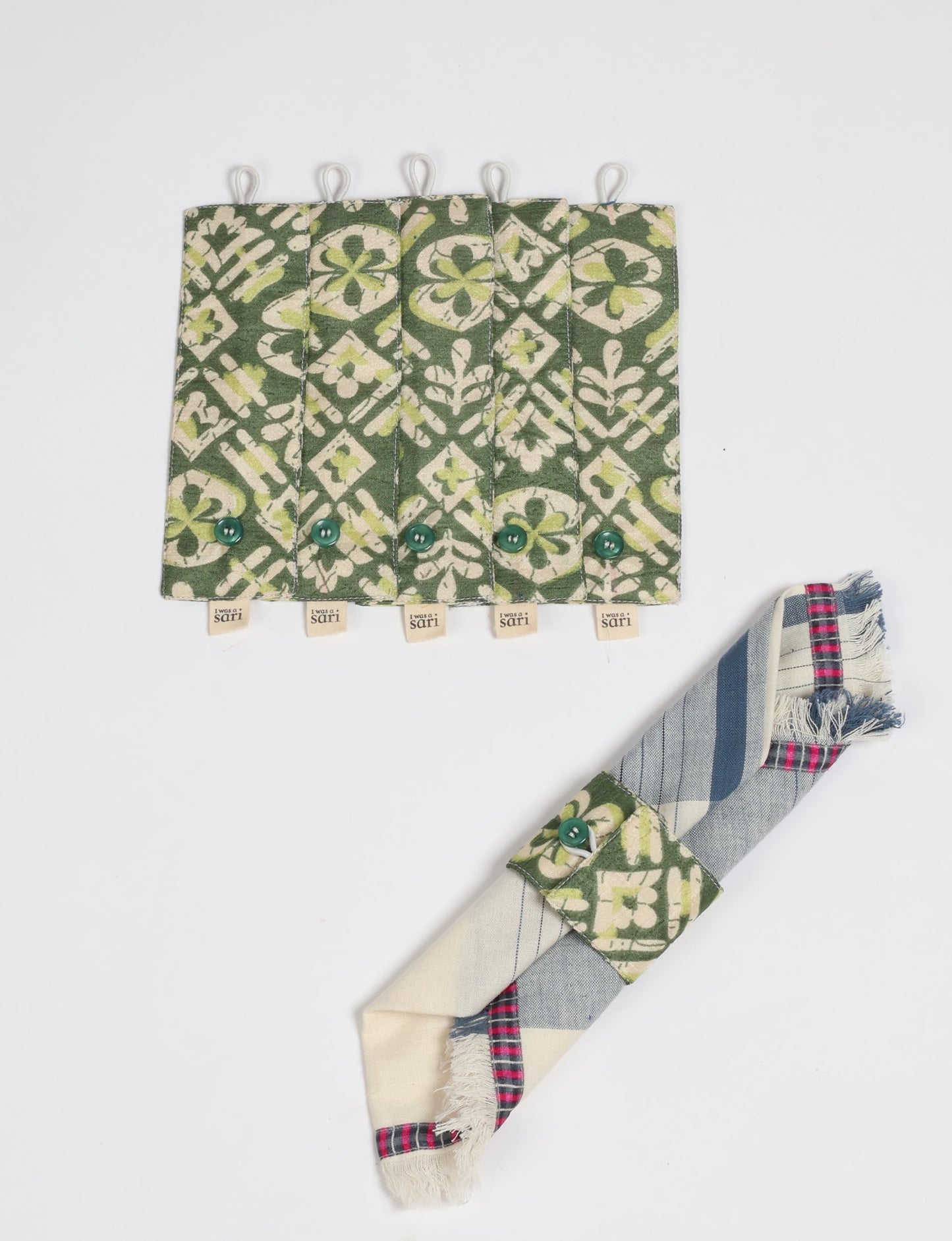 A set of 6 napkin rings made from repurposed saris, showcasing the beauty of sustainable fashion and upcycled materials. These stylish, eco-friendly rings with button closures are ideal for adding a touch of environmentally conscious elegance to your dining table.