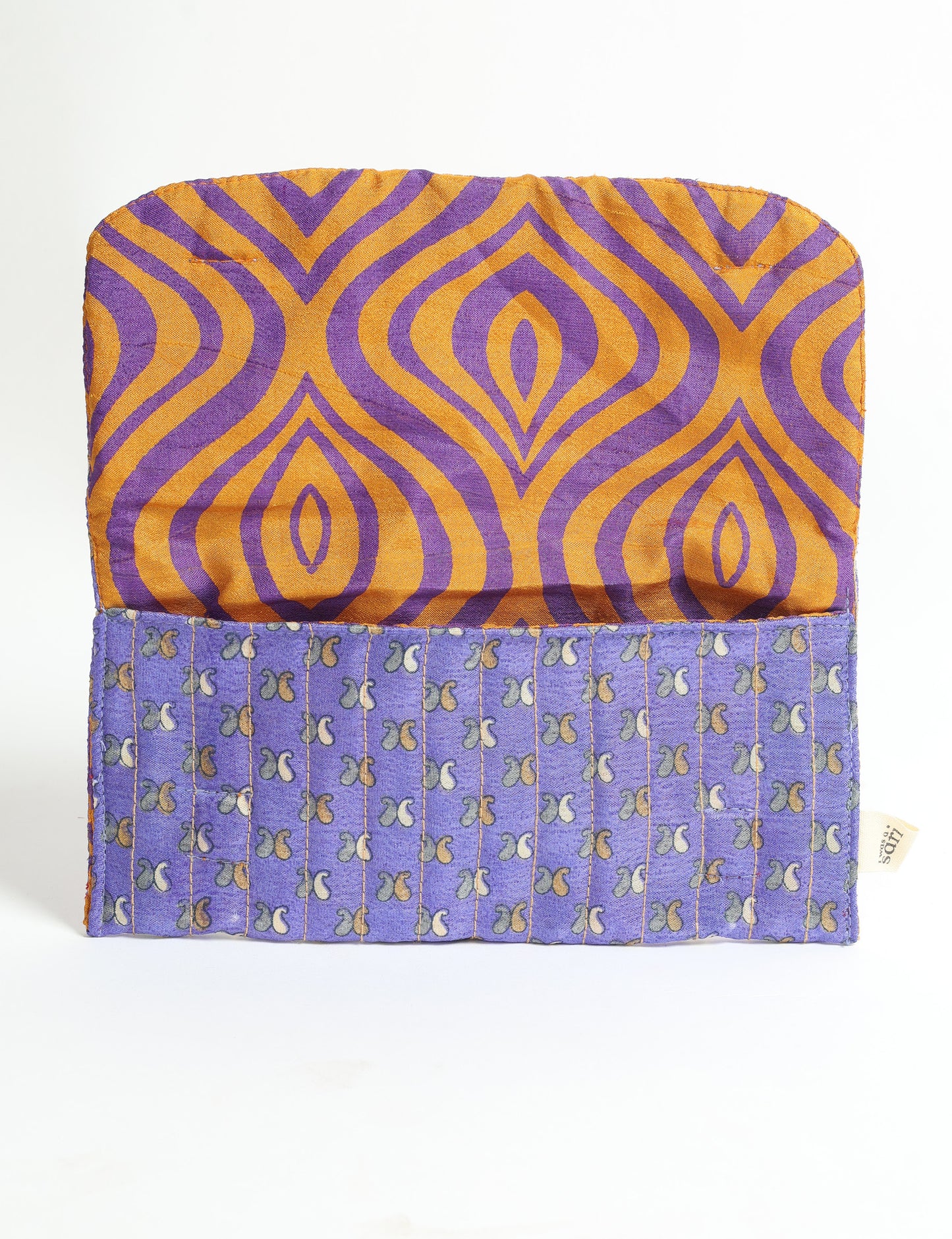 Quilted sunglasses case made from recycled sari products, featuring a secure magnetic closure. A chic example of ethical fashion, conscious clothing, and carbon neutral fashion. Protect your sunglasses while embracing circular fashion and upcycled garments.