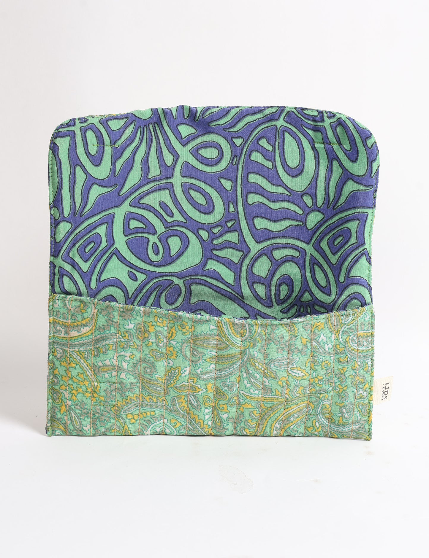 Quilted sunglasses case made from recycled sari products, featuring a secure magnetic closure. A chic example of ethical fashion, conscious clothing, and carbon neutral fashion. Protect your sunglasses while embracing circular fashion and upcycled garments.
