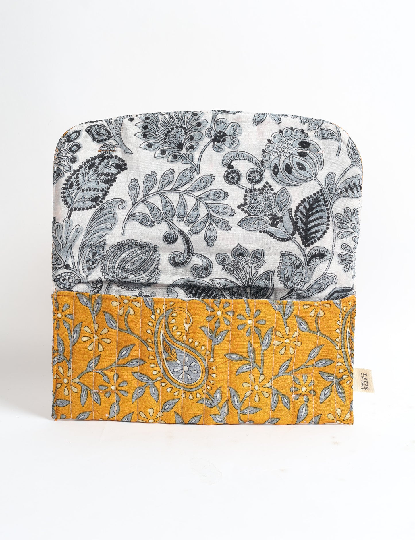 Quilted sunglasses case made from recycled sari products, featuring a secure magnetic closure. A chic example of ethical fashion, conscious clothing, and carbon neutral fashion. Protect your sunglasses while embracing circular fashion and upcycled garments.