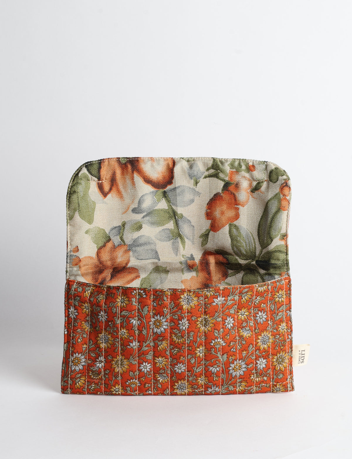 Quilted sunglasses case made from recycled sari products, featuring a secure magnetic closure. A chic example of ethical fashion, conscious clothing, and carbon neutral fashion. Protect your sunglasses while embracing circular fashion and upcycled garments.